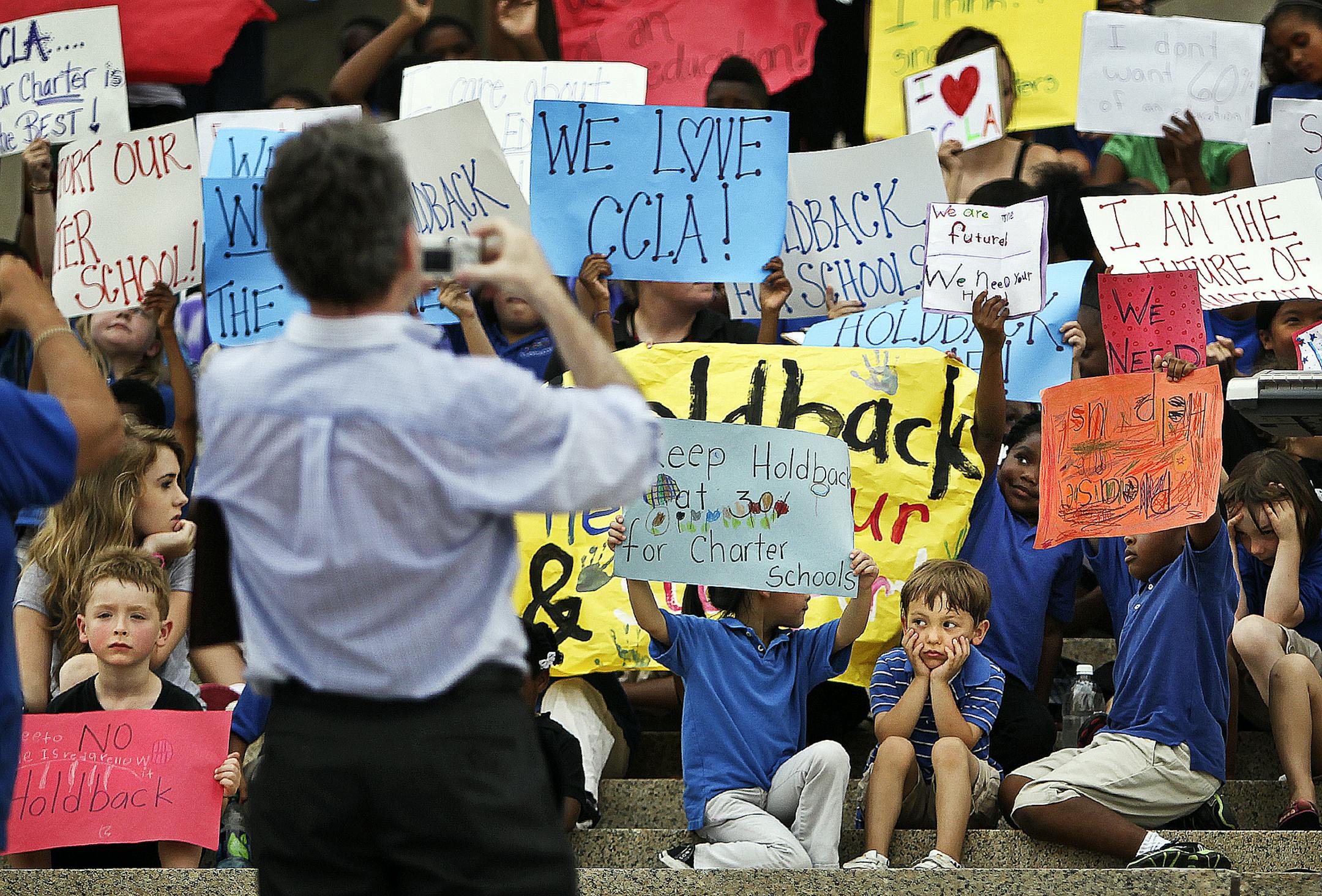 Charter school students held signs as they joined leaders of the quality choice school movement Tuesday morning, Tuesday, July 19, 2011, on the steps of the Capitol, urging Gov. Mark Dayton and the legislature to grant charter schools a waiver from a proposed plan to increase holdbacks from 30 to 40 percent. Several hundred students from Concordia Creative Learning Academy, Harvest Prep and Best Academy, and Higher Ground participated in the rally.] St. Paul, MN - DAVID JOLES â€¢