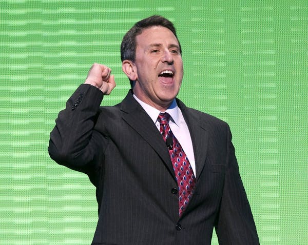 Brian Cornell, an executive vice president at Wal-Mart Stores Inc. and chief executive officer of Sam's Club, leads a cheer during the during the annu