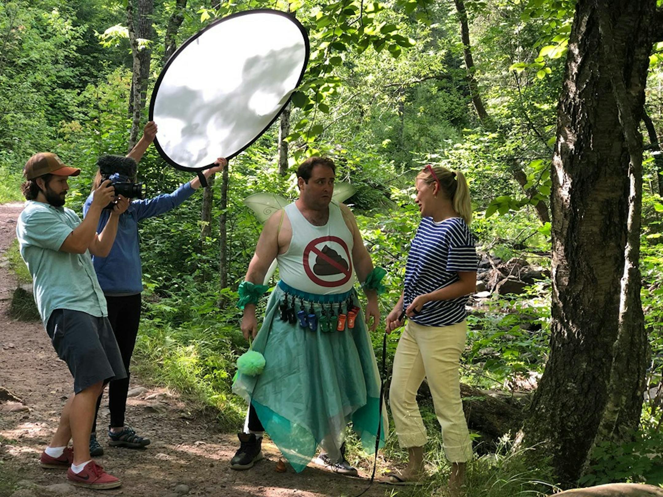 Duluth actor Jody Kujawa plays the poop fairy in a video released Friday reminding pet owners like the one played by Jenna Kelly to pick up after their pets for the sake of clean water (and personal reponsibility). Mike Jandl of Dange Bbird Productions, left, shoots the spot.
