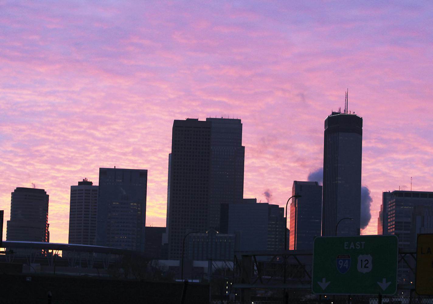 Sunlight filters through clouds to illuminate the Minneapolis skyline Thursday, Dec. 27, 2012, in Minneapolis, MN. Sun will give way to clouds and snow later today.] (DAVID JOLES/STARTRIBUNE) djoles@startribune.com Sunlight filters through clouds to illuminate the Minneapolis skyline Thursday, Dec. 27, 2012, in Minneapolis, MN. ORG XMIT: MIN1212270953330810