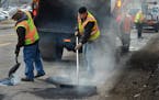 St. Paul public works employees filled potholes and did other street maintenance work.