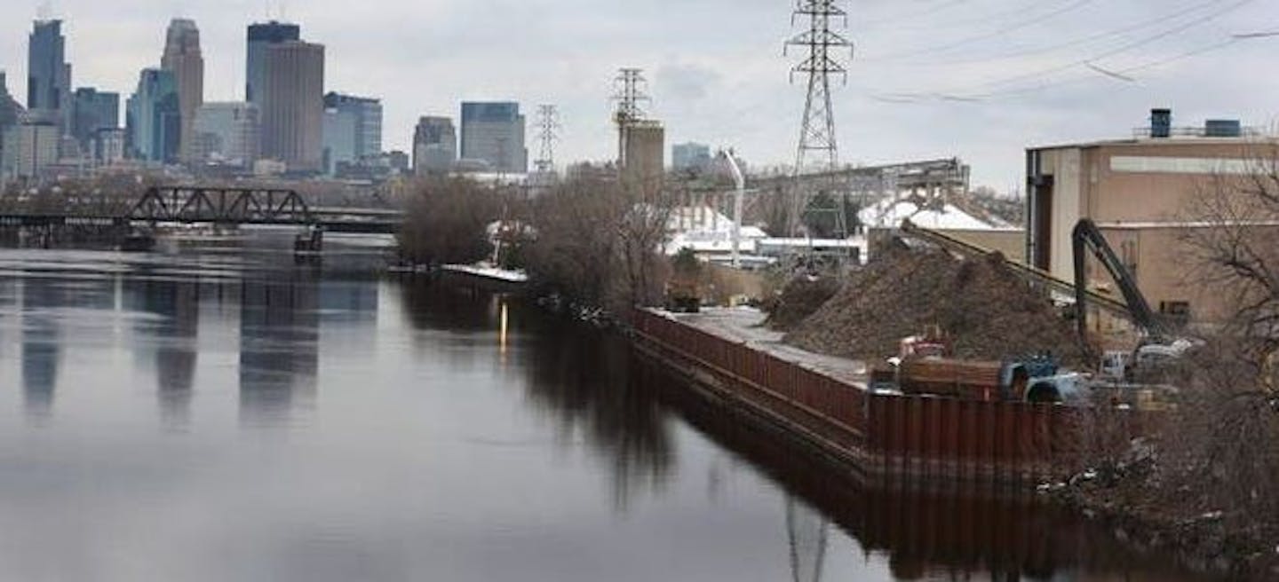 The Northern Metals Recycling facility, located on the Mississippi River just south of the Lowry Avenue Bridge in Minneapolis. Families in north Minneapolis neighborhoods can now receive free asthma and lead consultations as part of a settlement between the facility and Minnesota Pollution Control Agency.