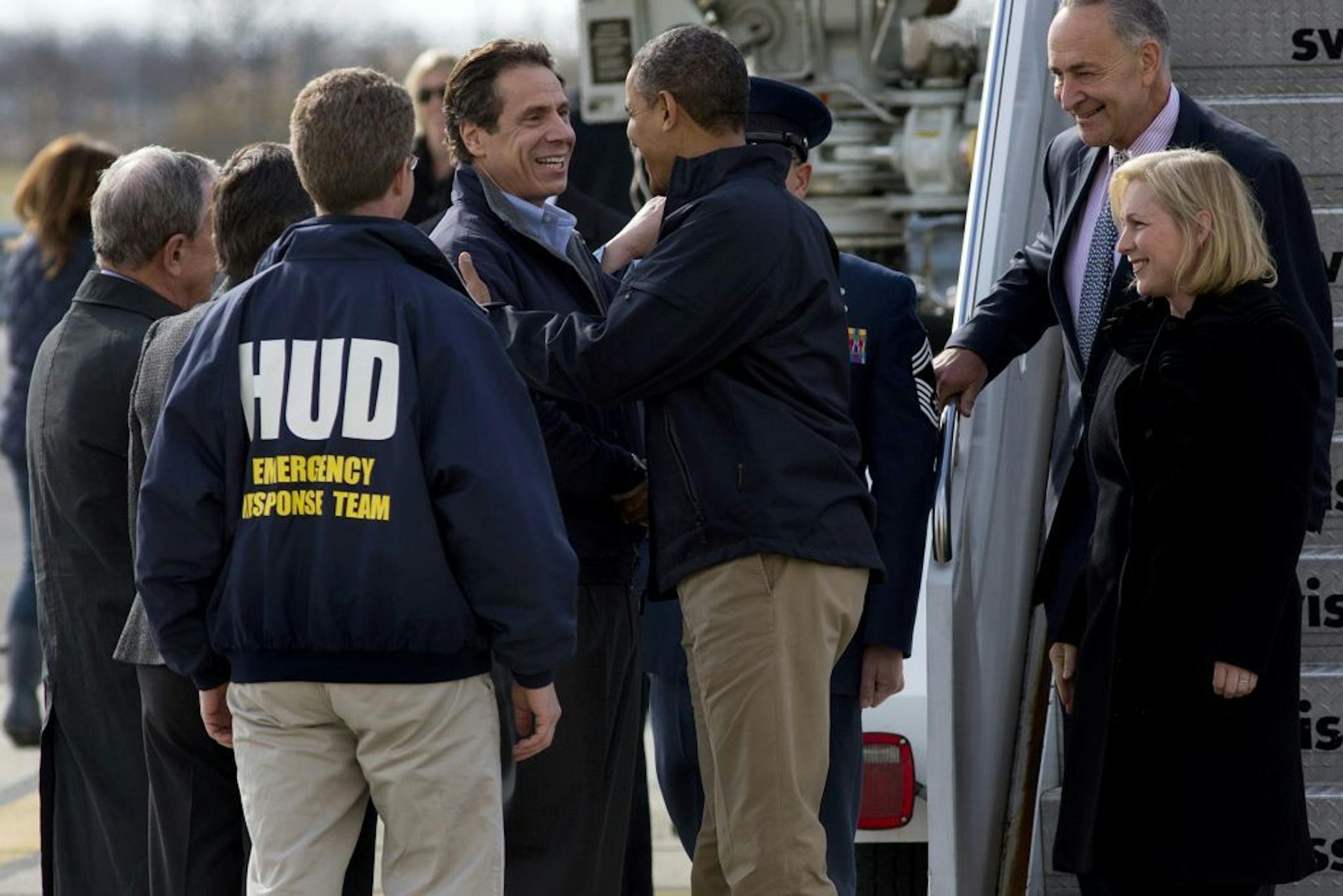 President Barack Obama is greeted by New York Gov. Andrew Cuomo upon his arrival at JFK International Airport in New York Thursday, Nov. 15, 2012, before taking a aerial tour of damage along the New York coastline in the of Superstorm Sandy. From left are, New York City Mayor Michael Bloomberg, Housing and Urban Development Secretary Shaun Donovan, in HUD jacket, Cuomo, the president, Sen. Kirsten Gillibrand, D-N.Y., and Sen. Charles Schumer, D-N.Y.
