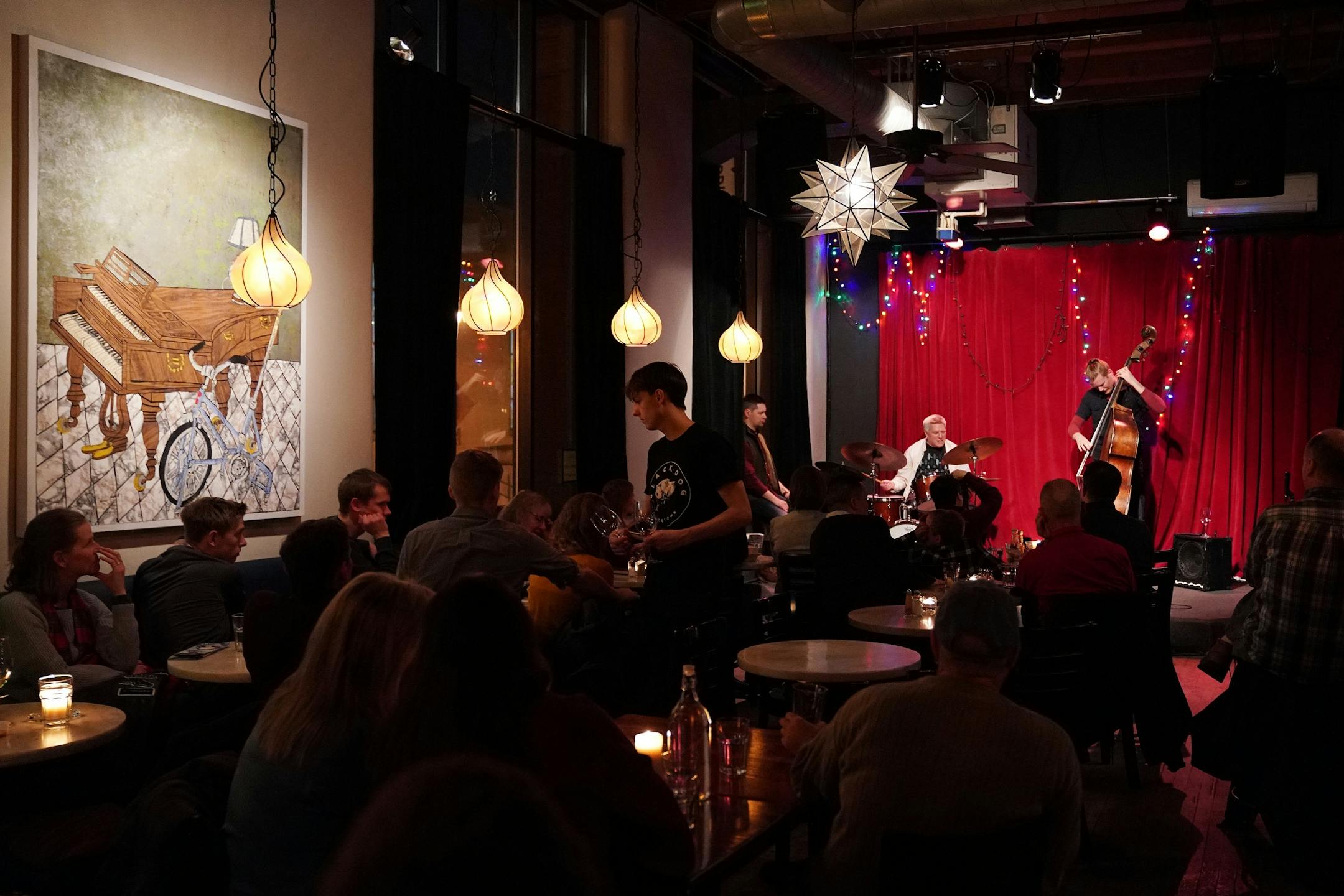 John Raymond on the trumpet, Graydon Peterson on the bass, and Phil Hey on the drums entertained the crowd with Jazz Saturday evening at the Black Dog Cafe.