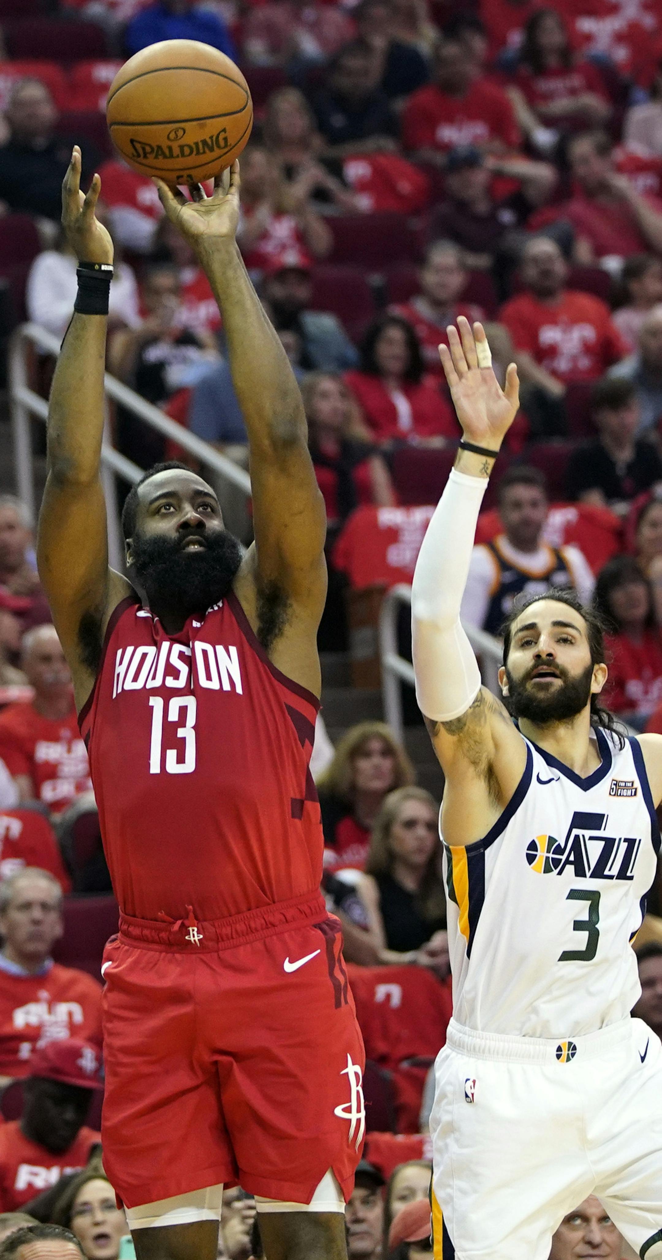 Houston Rockets guard James Harden (13) shoots past Utah Jazz guard Ricky Rubio (3) during the first half in Game 5 of an NBA basketball playoff series, in Houston, Wednesday, April 24, 2019. (AP Photo/David J. Phillip)