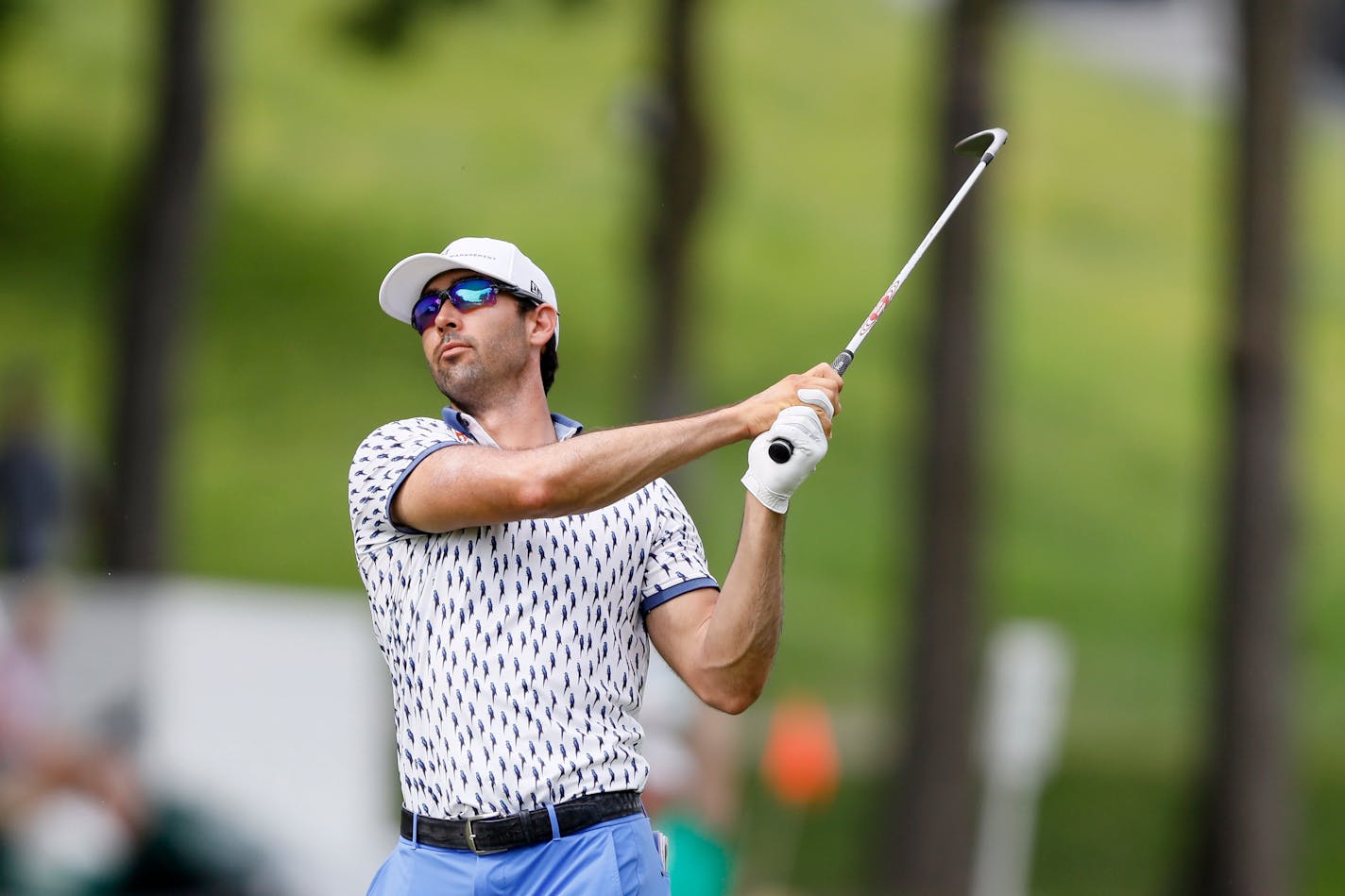 Cameron Tringale hits on the 18th fairway during the third round of the John Deere Classic last July