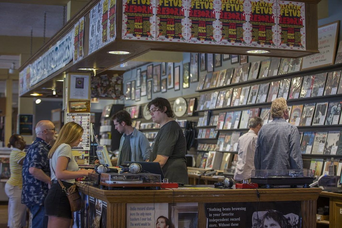 Patrons checked on at the iconic register area at Electric Fetus, Friday, June 1, 2018 in Minneapolis, MN.