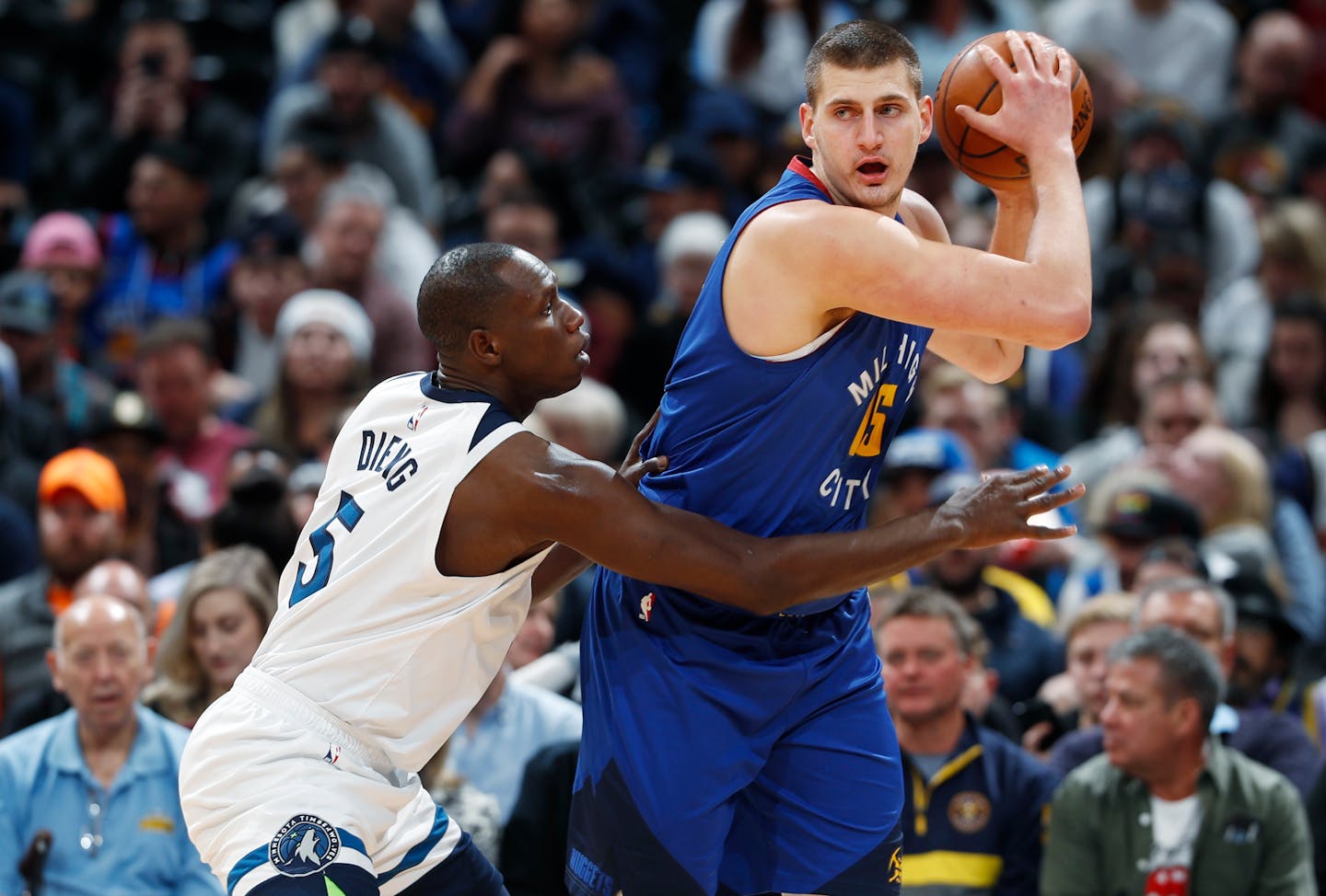 Gorgui Dieng (left, defending against Nuggets center Nikola Jokic) has stepped up as a Timberwolves starter in Towns' absence, averaging 15.3 points and 8.7 rebounds over the past three games.