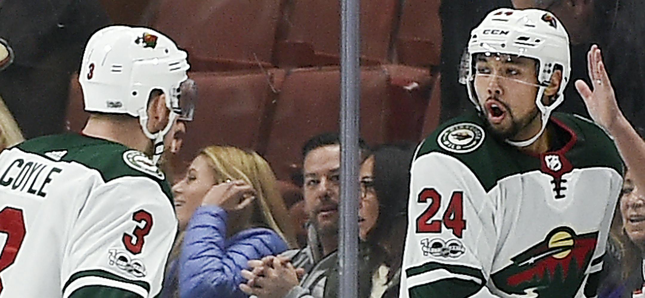 Minnesota Wild defenseman Matt Dumba, right, celebrates with center Charlie Coyle after scoring during overtime of an NHL hockey game against the Anaheim Ducks in Anaheim, Calif., Friday, Dec. 8, 2017. The Wild won 3-2. (AP Photo/Kelvin Kuo)