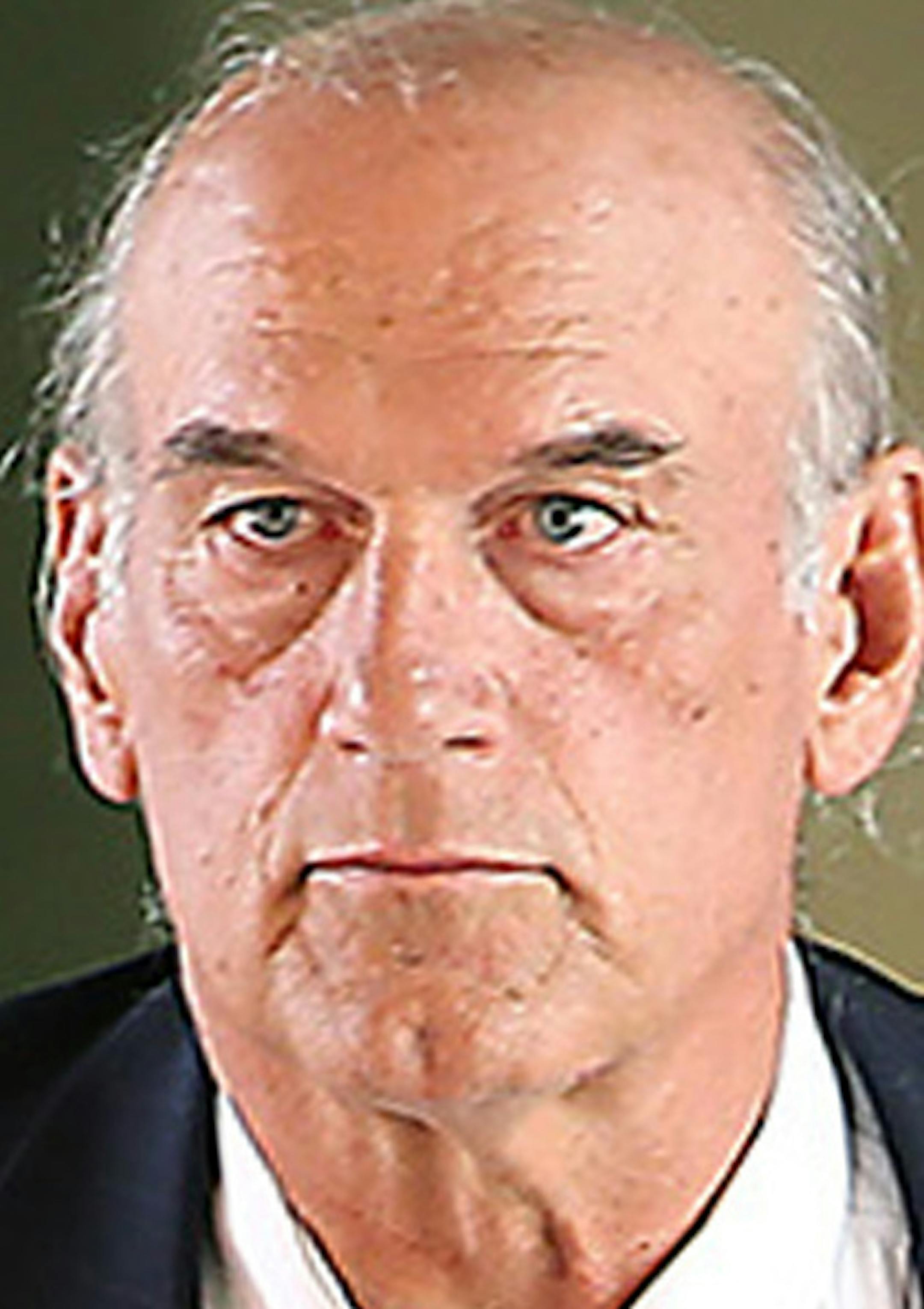 FILE - In this July 8, 2014 file photo former Minnesota Gov. Jesse Ventura, center, leaves federal court in St. Paul, Minn. A jury awarded $1.8 million to former Minnesota Gov. Jesse Ventura in his lawsuit against the estate of late "American Sniper" author Chris Kyle in July. The jury decided Kyle defamed Ventura when he claimed to have punched out Ventura at a California bar for bad-mouthing the Navy SEALs in 2006. (AP Photo/The Star Tribune, Elizabeth Flores, File)