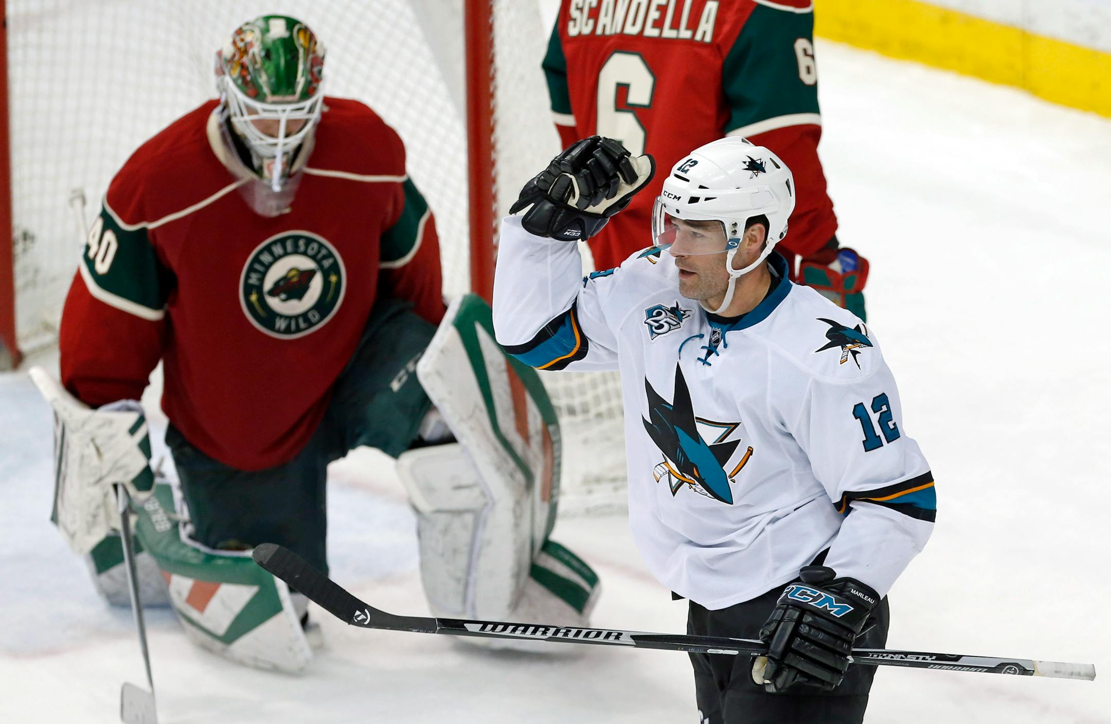 San Jose Sharks' Patrick Marleau, right, celebrates as he scores his second goal against the Wild on Tuesday night.