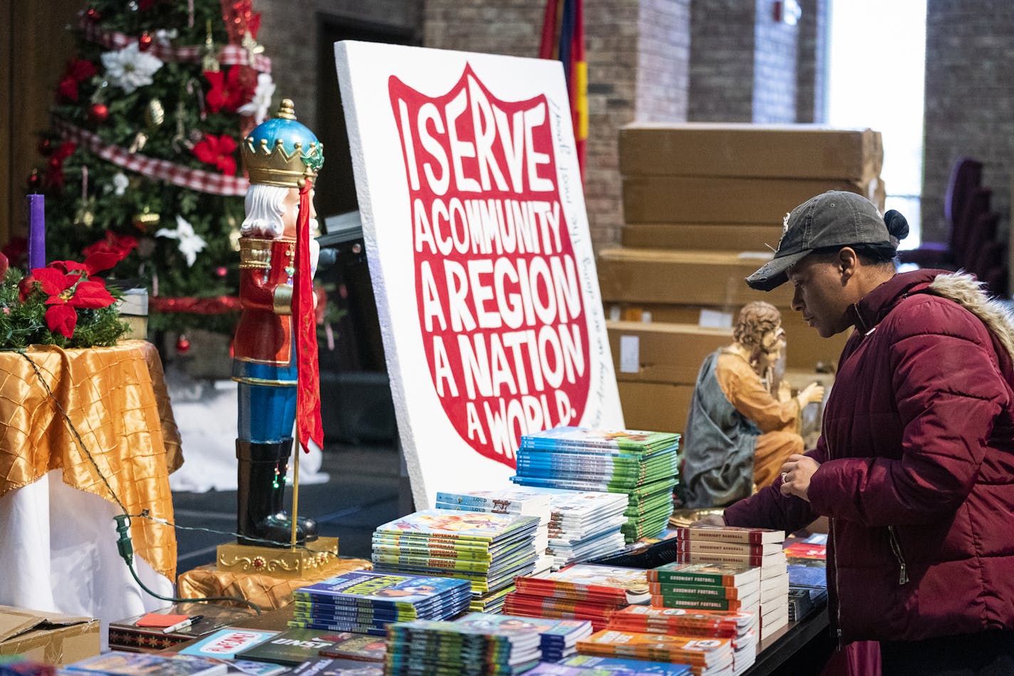 Shaunte Houston of Minneapolis picked out toys for her three children at the Salvation Army Toy Shop last year.