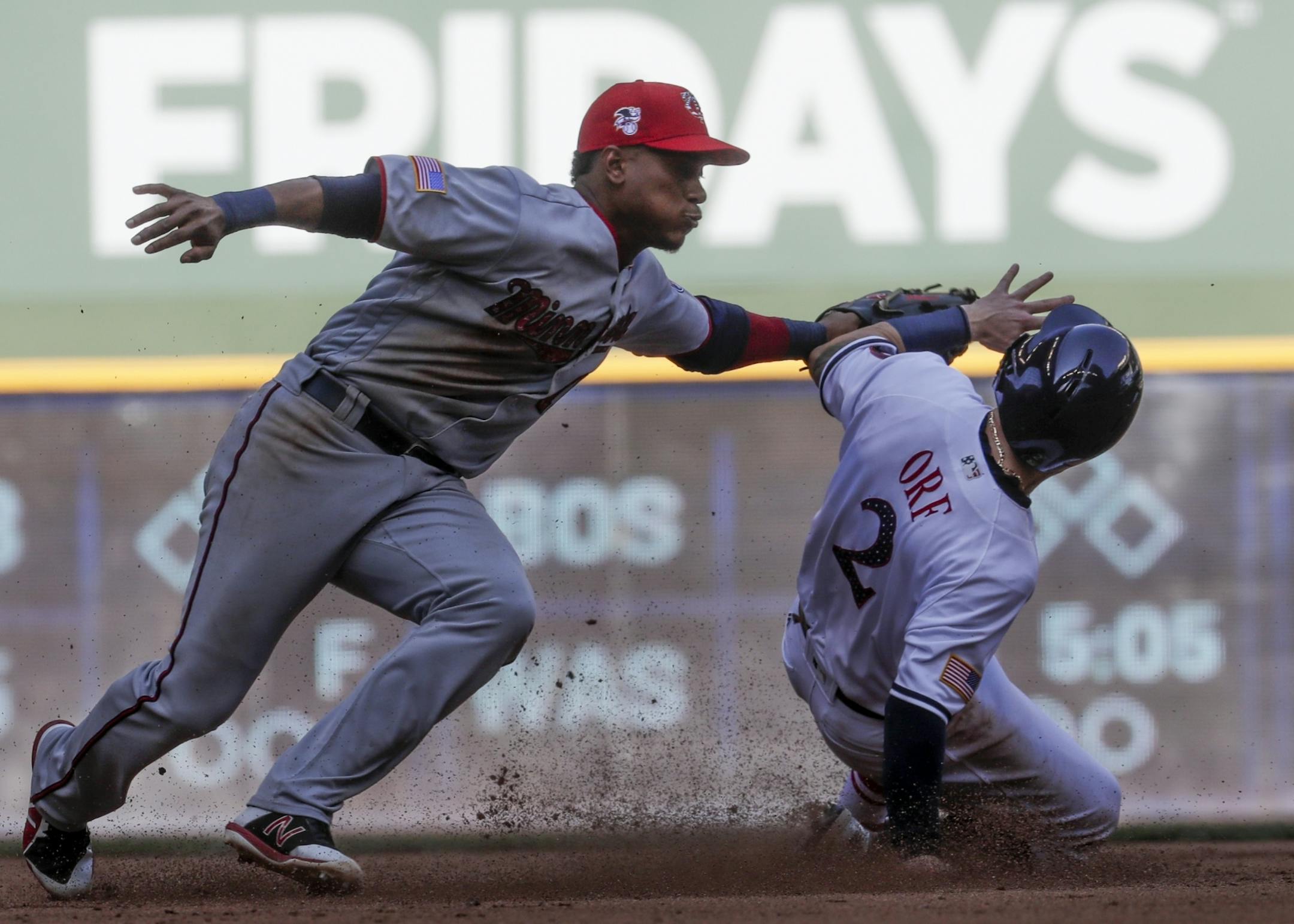 Milwaukee Brewers' Nate Orf steals second with Minnesota Twins' Jorge Polanco covering during the fifth inning of a baseball game Tuesday, July 3, 2018, in Milwaukee.