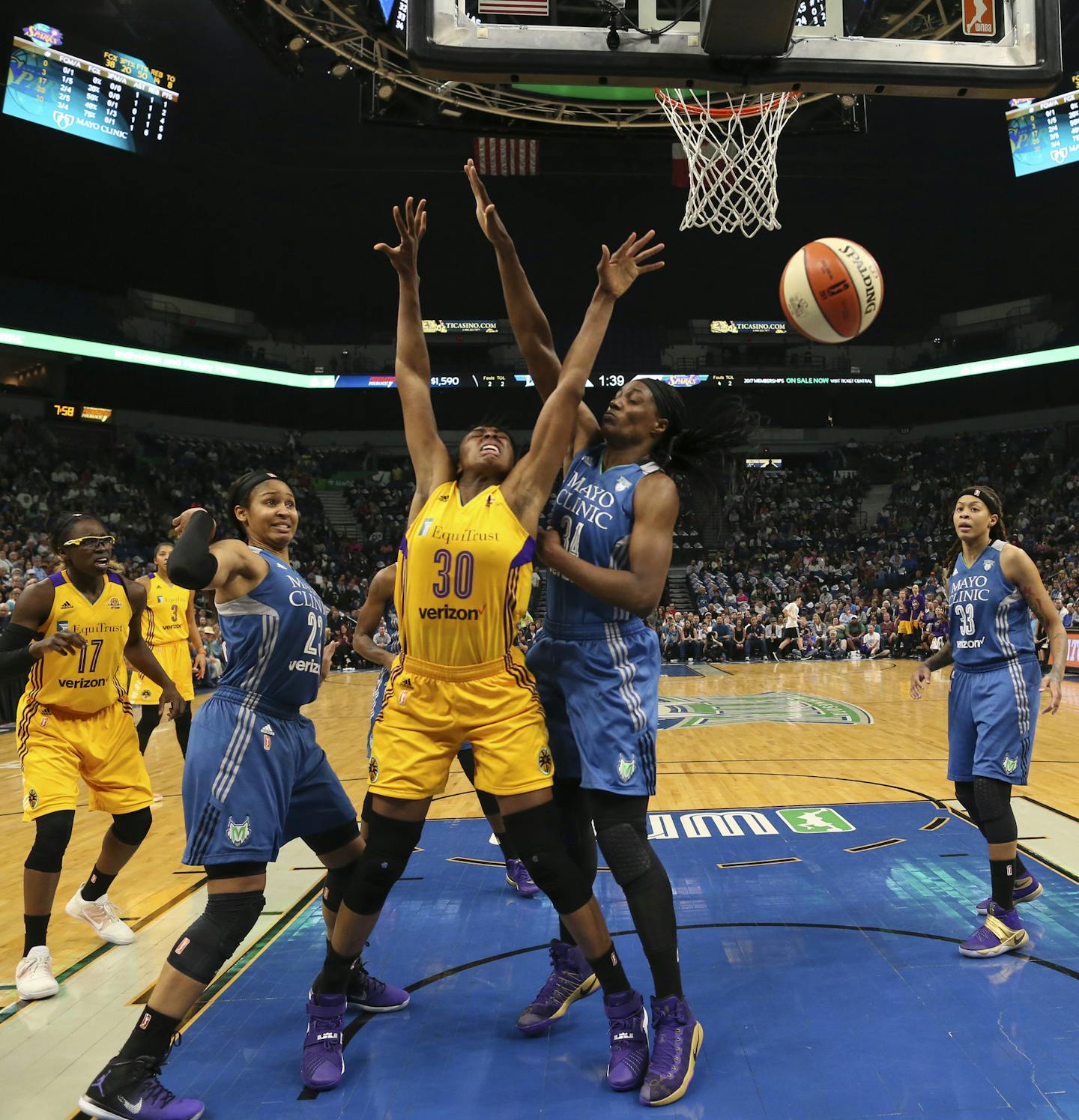 Los Angeles Sparks forward Nneka Ogwumike (30) was fouled by Minnesota Lynx forward Maya Moore (23) in the second quarter. Also defending Ogwumike was Minnesota Lynx center Sylvia Fowles (34). ] JEFF WHEELER &#xef; jeff.wheeler@startribune.com The Minnesota Lynx beat the Los Angeles Sparks 79-60 in Game 2 of their WNBA Championship series Tuesday night, October 11, 2016 at Target Center in Minneapolis.