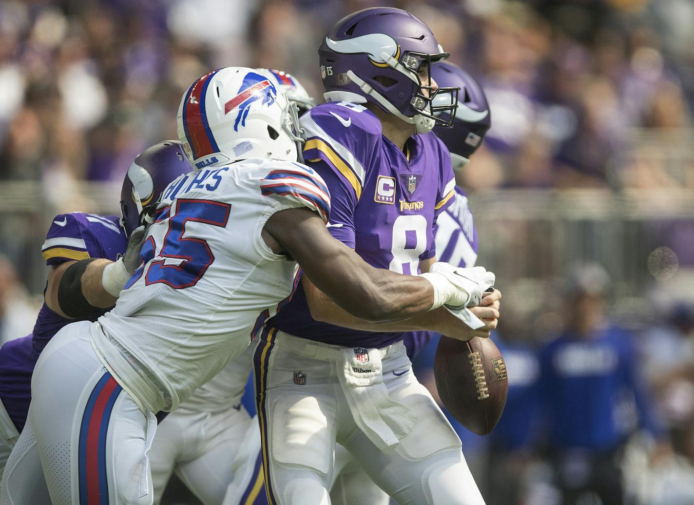 Minnesota Vikings quarterback Kirk Cousins (8) fumbles the football after he is hit by Buffalo Bills defensive end Jerry Hughes (55) on Sunday, Sept. 23, 2018 at U.S. Bank Stadium in Minneapolis, Minn. (Jerry Holt/Minneapolis Star Tribune/TNS) ORG XMIT: 1241085