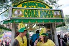 Friends Danny Suelter, left, and Katelyn Christensen of Minneapolis made a stop at Poncho Dog’s Corn Dogs stand in 2022. 