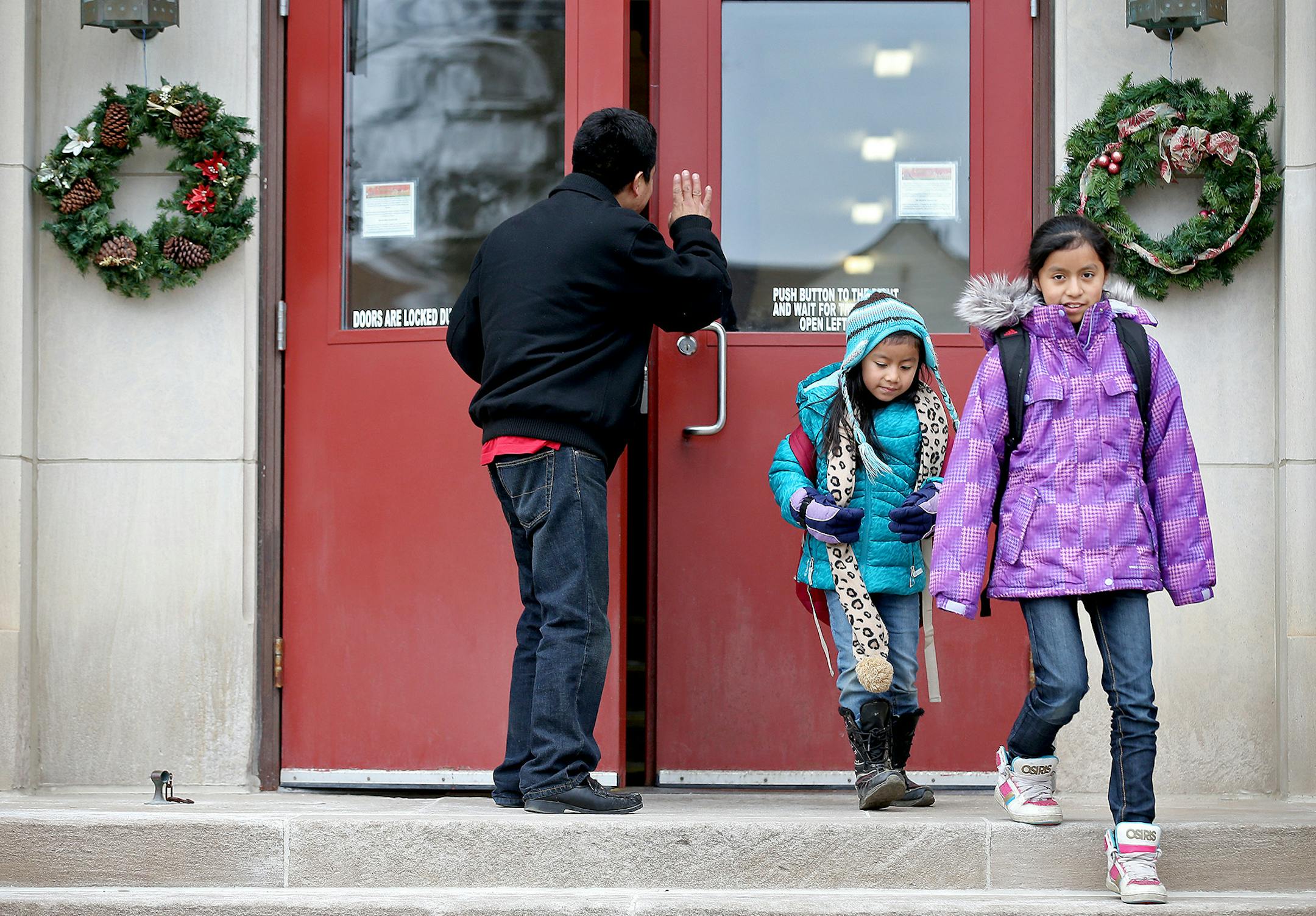 Jacobo Gabriel-Tomas picked up his kids Daisy, 6, left, Beatriz, 11, and Elvin, 10. (not shown), from St. Mary's Catholic School, Tuesday, December 09, 2014 in Worthington, MN. ] (ELIZABETH FLORES/STAR TRIBUNE) ELIZABETH FLORES &#x2022; eflores@startribune.com