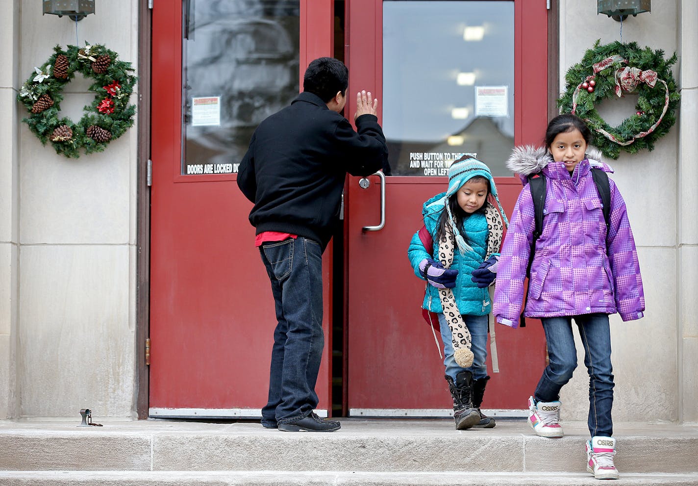 Jacobo Gabriel-Tomas picked up his kids Daisy, 6, left, Beatriz, 11, and Elvin, 10. (not shown), from St. Mary's Catholic School, Tuesday, December 09, 2014 in Worthington, MN. ] (ELIZABETH FLORES/STAR TRIBUNE) ELIZABETH FLORES &#x2022; eflores@startribune.com