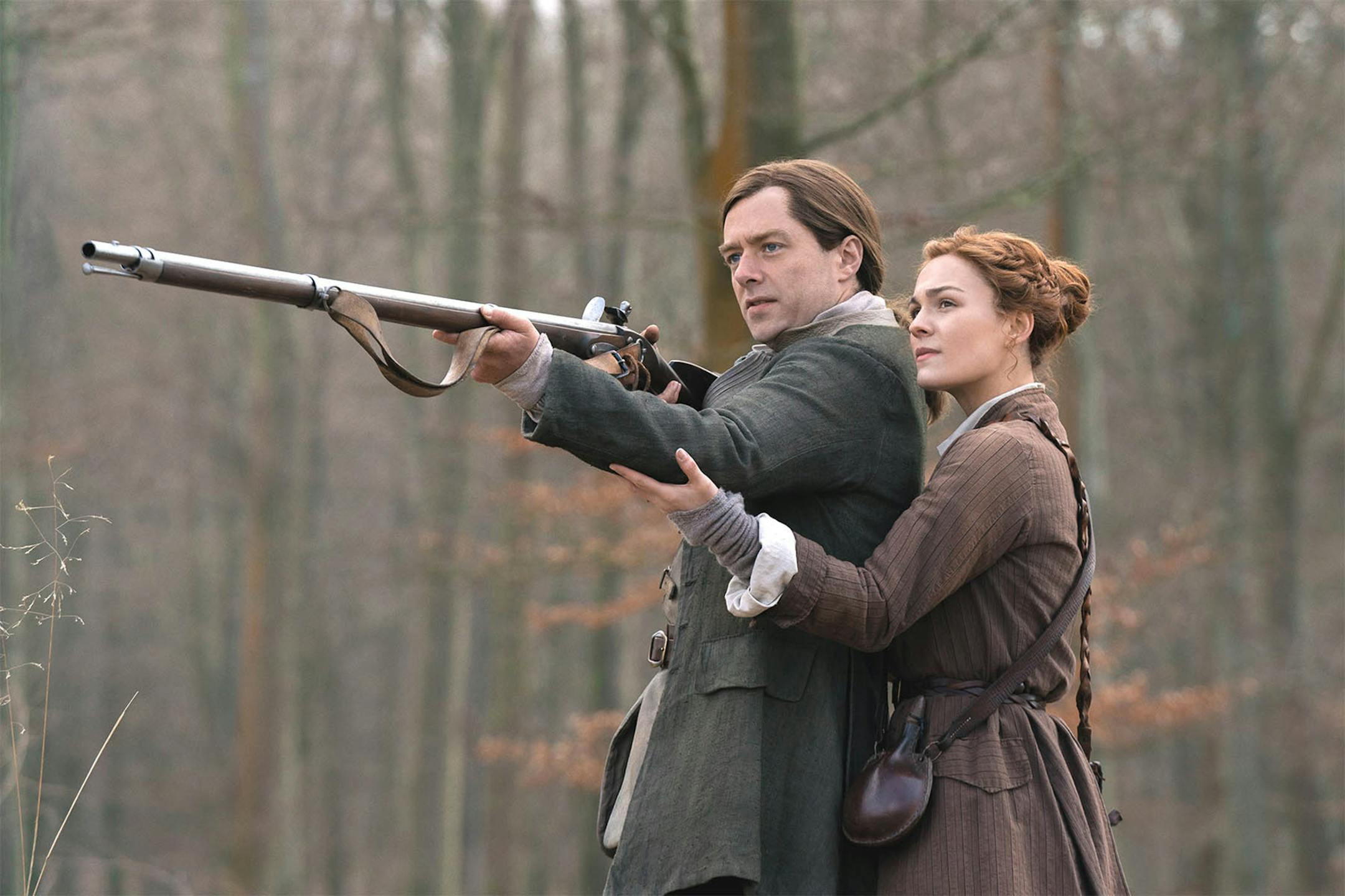 Richard Rankin and Sophie Skelton in the Starz series, "Outlander." (Aimee Spinks/Starz Entertainment/TNS) ORG XMIT: 1576858