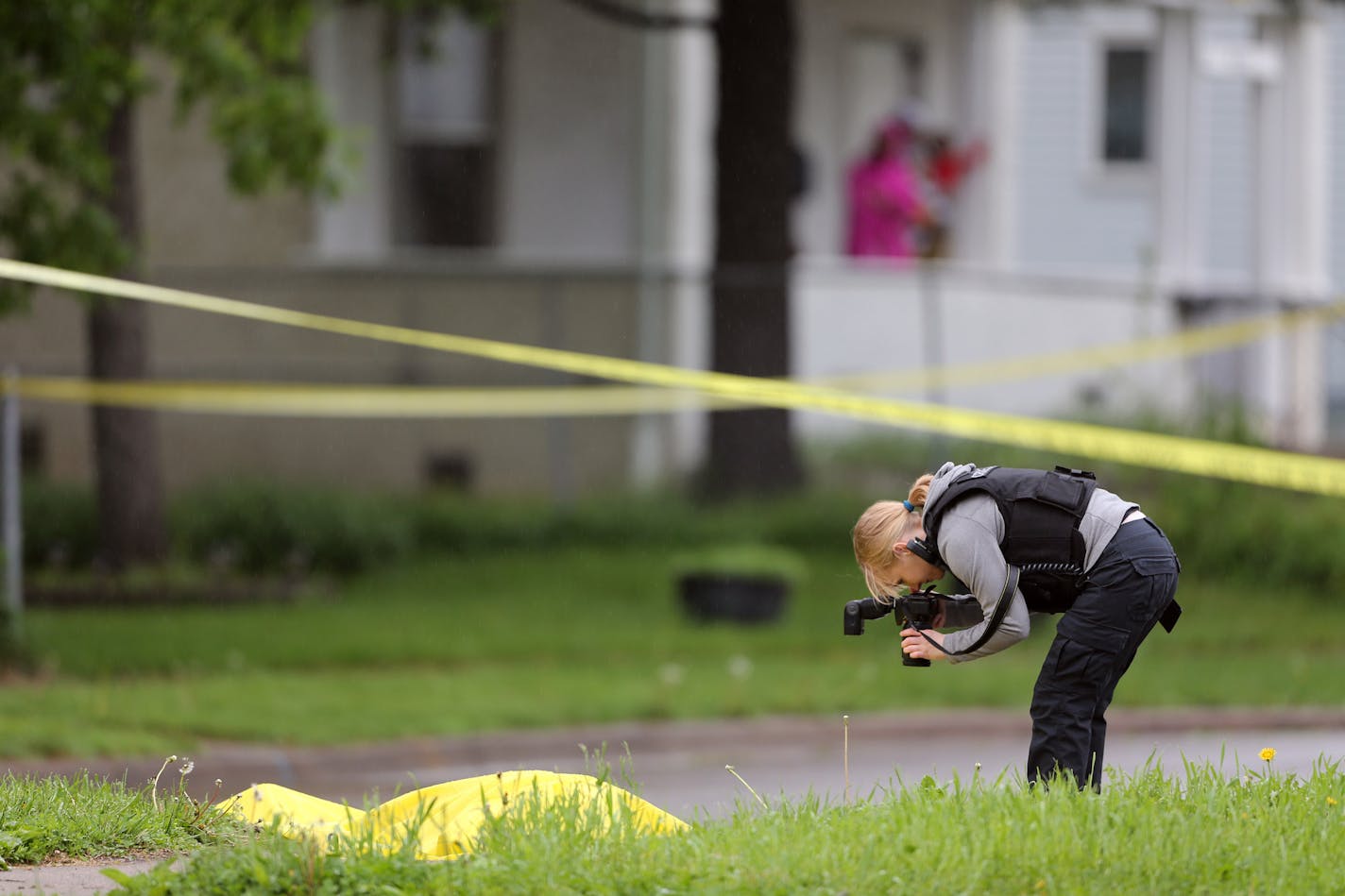 A crime scene investigator photographed a body near Olson Memorial Highway in May 2016.