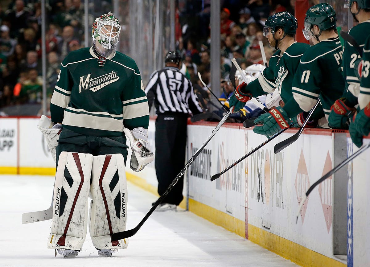 Minnesota Wild goalie Devan Dubnyk (40) skated off the ice after being replaced by Darcy Kuemper (25) in the second period on Game 4.