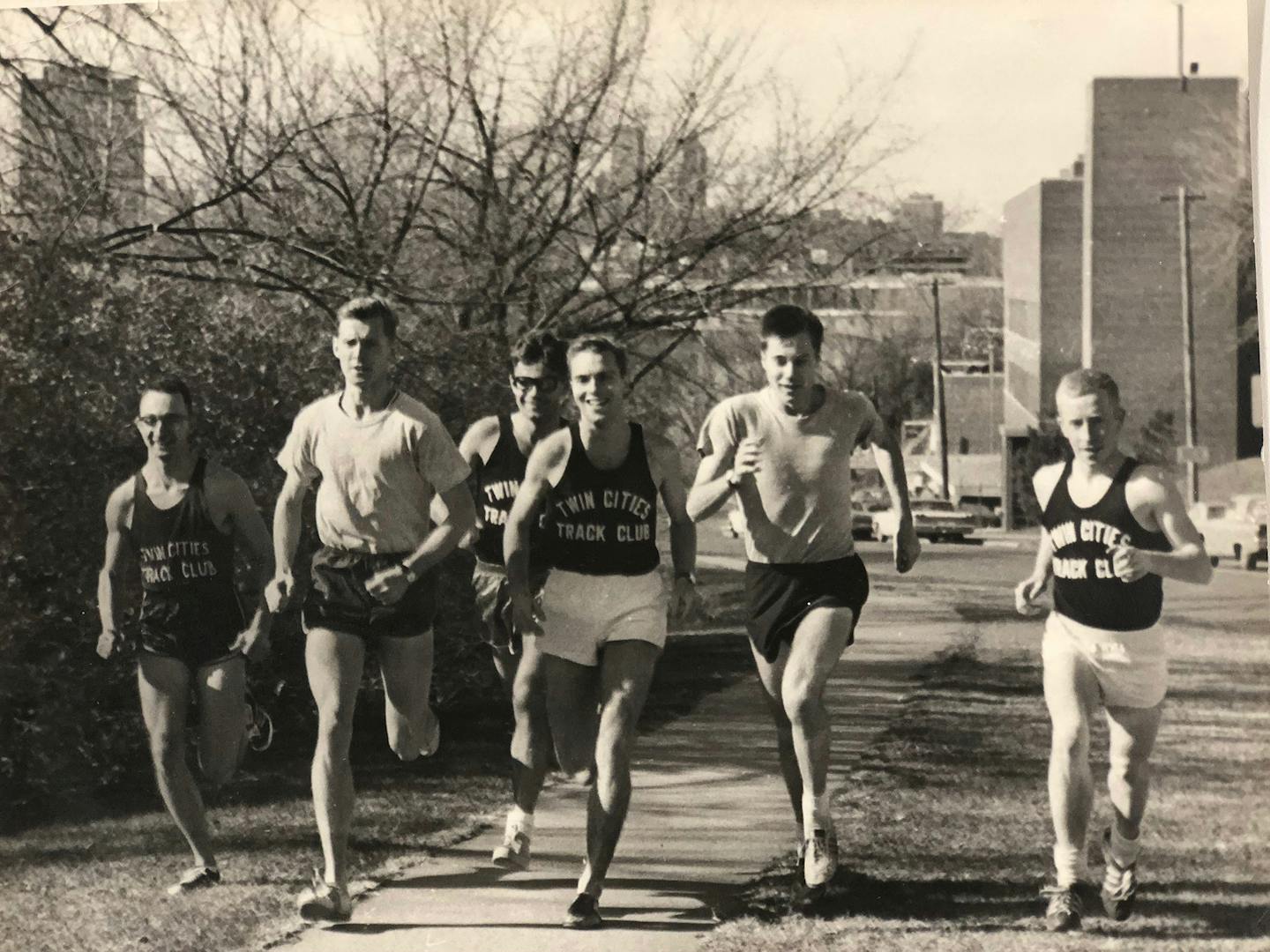 Twin Cities Track Clubbers Tom Heinonen, third from left, Ron Daws, second from right, and Jeff Reneau, right, on a run in 1965