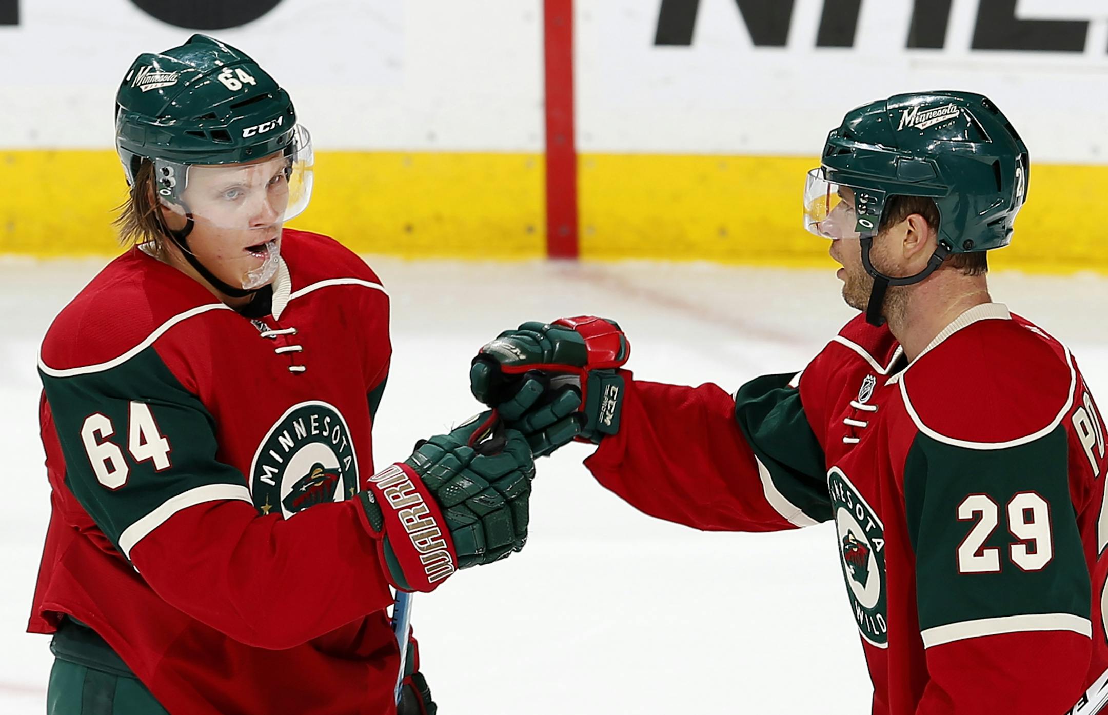 Mikael Granlund (64) celebrated with Jason Pominville (29). after scoring a goal in the second period.