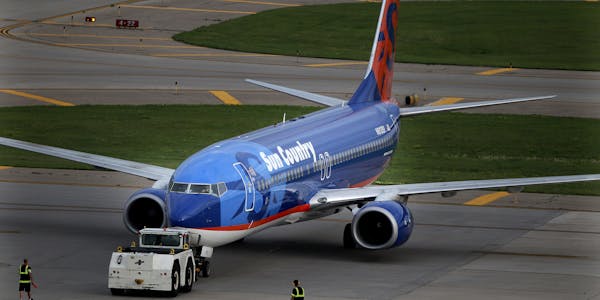 A Sun Country airplane was being prepared for take off early Friday, July 22, 2011, at the Humphrey terminal in Bloomington, MN.] (ELIZABETH FLORES/ST