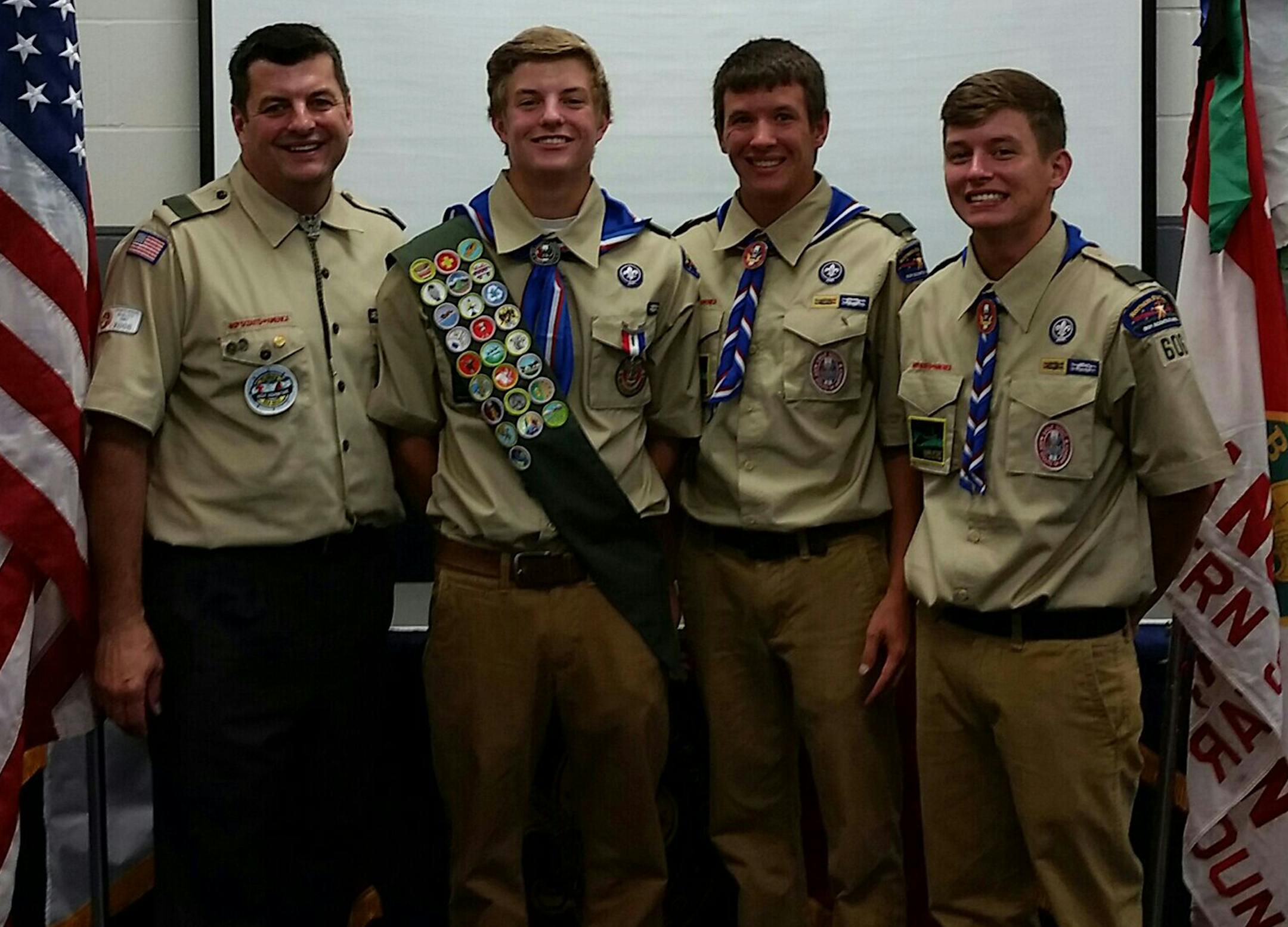 Paul Fisher, second from left, received his Eagle Scout Award July 12 at a special Court of Honor Ceremony at the Champlin Ice Forum. He joins his dad, Brian, left, and brothers Peter, second from right, and Jack as Eagle Scouts. Photo courtesy Debbie Fisher
