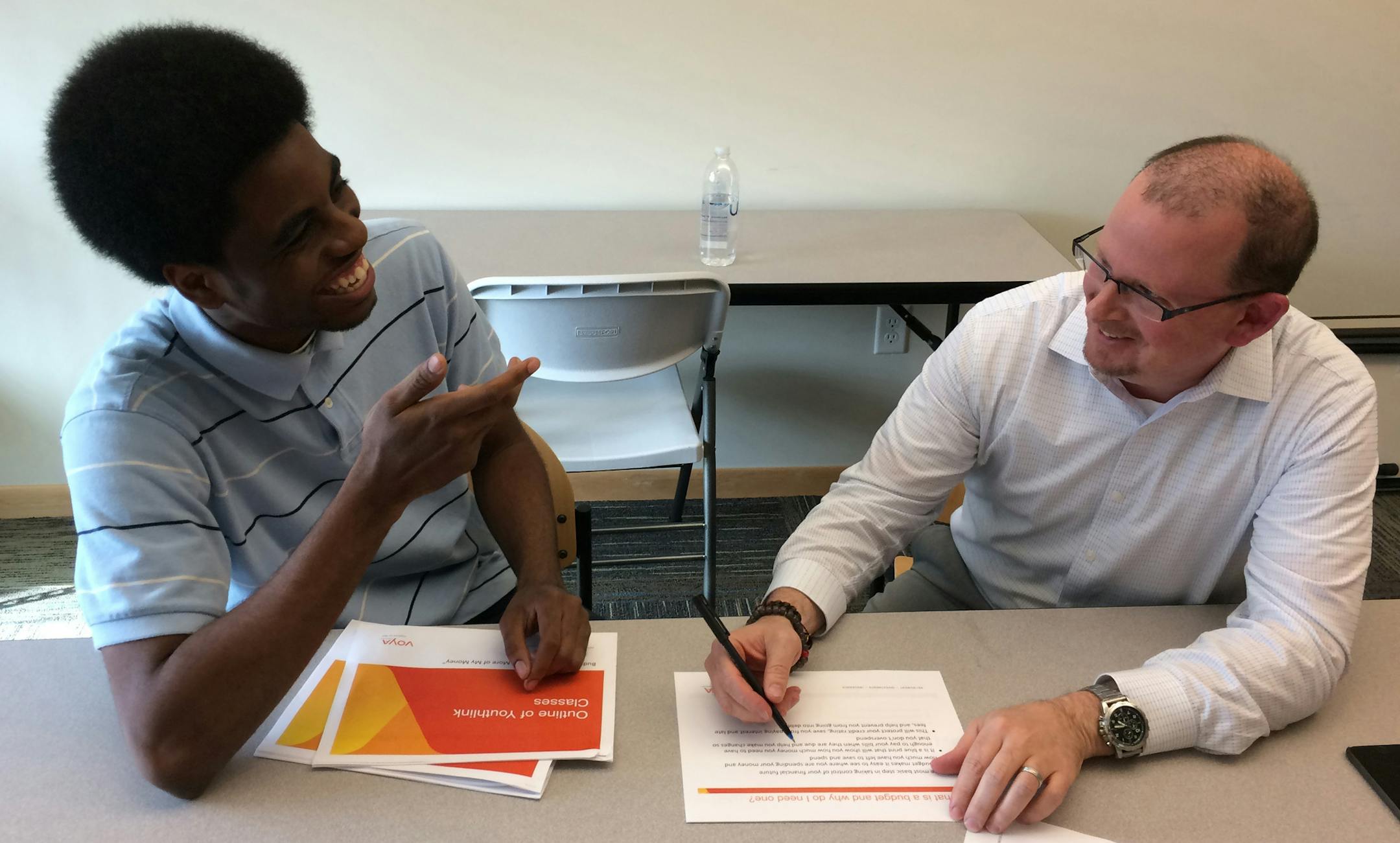 Navares Ladd, 19, and financial literacy mentor Steve Burk. credit: Gail Rosenblum, Star Tribune