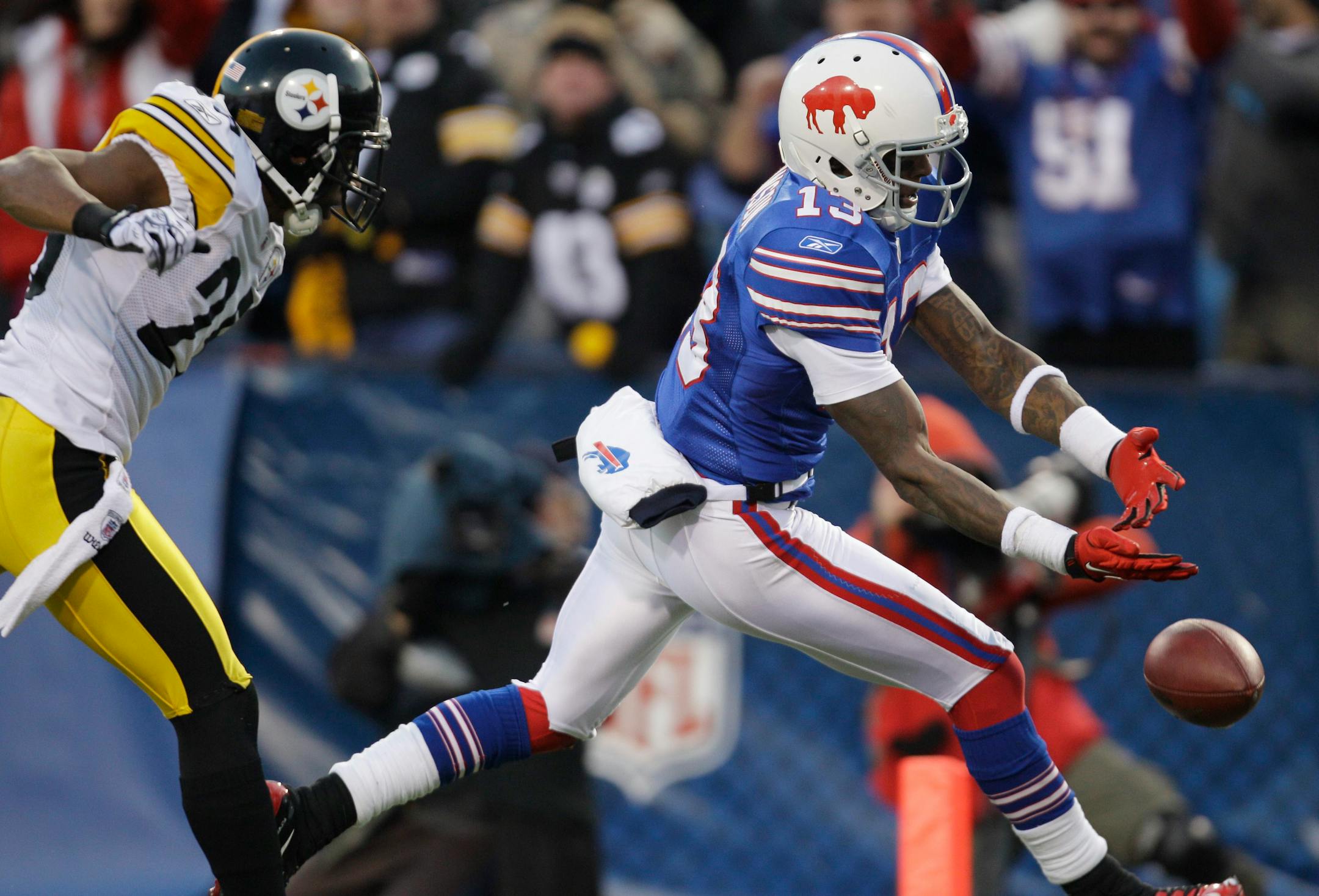 Buffalo Bills' Steve Johnson (13) misses a pass in the end zone in overtime under pressure from Pittsburgh Steelers' Ryan Clark (25) during an NFL football game in Orchard Park, N.Y., Sunday, Nov. 28, 2010. The Steelers won 19-16 in overtime. (AP Photo/David Duprey)