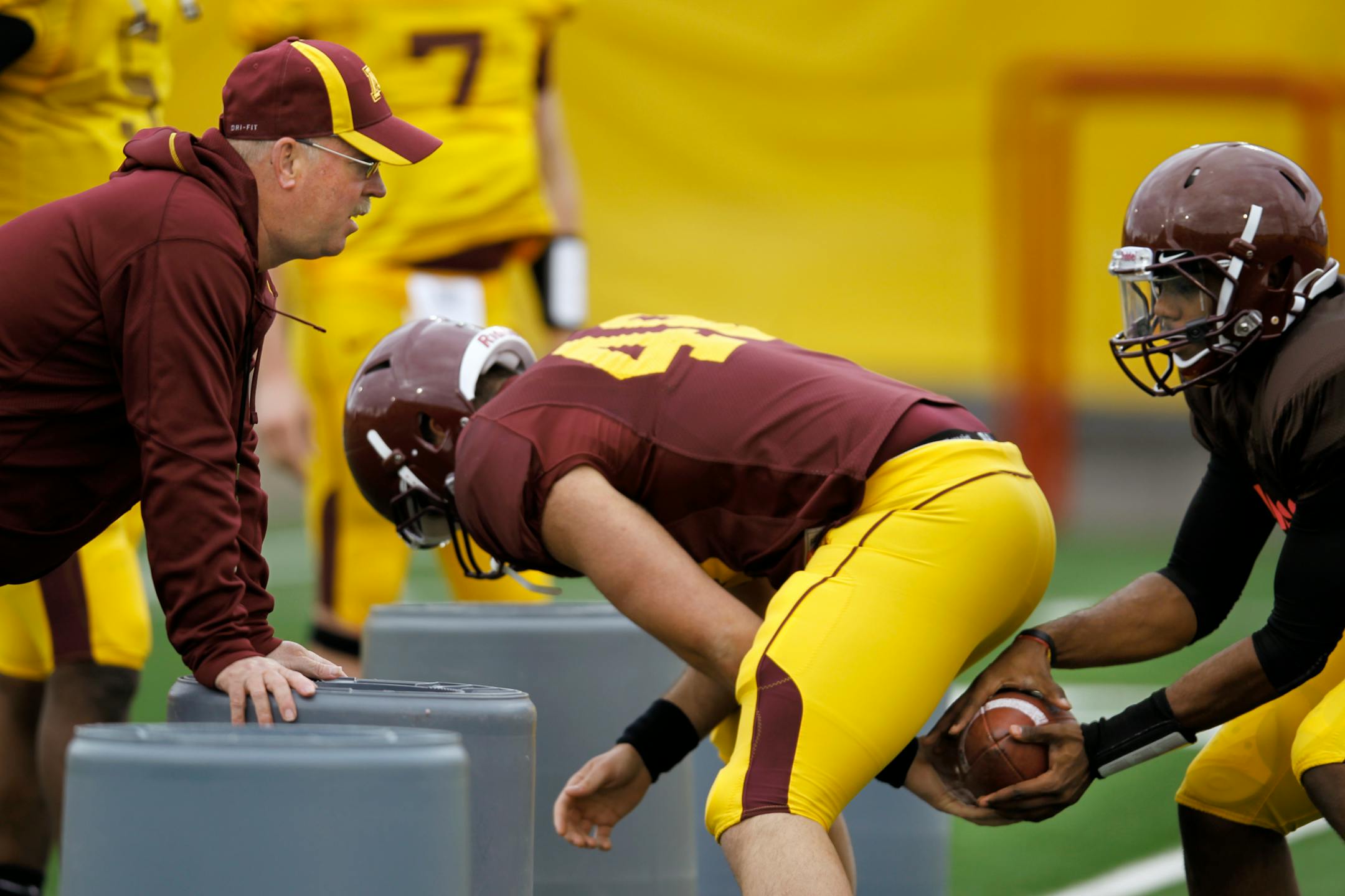 Gophers football coach Jerry Kill, left, asks his players to "play fast" — something they had trouble doing a year ago as they learned his system.