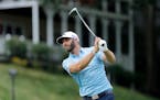 Dustin Johnson tees off on the 18th hole during the final round of the Travelers Championship