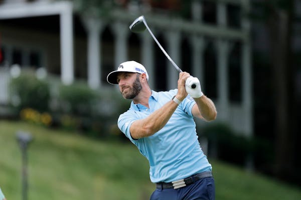 Dustin Johnson tees off on the 18th hole during the final round of the Travelers Championship