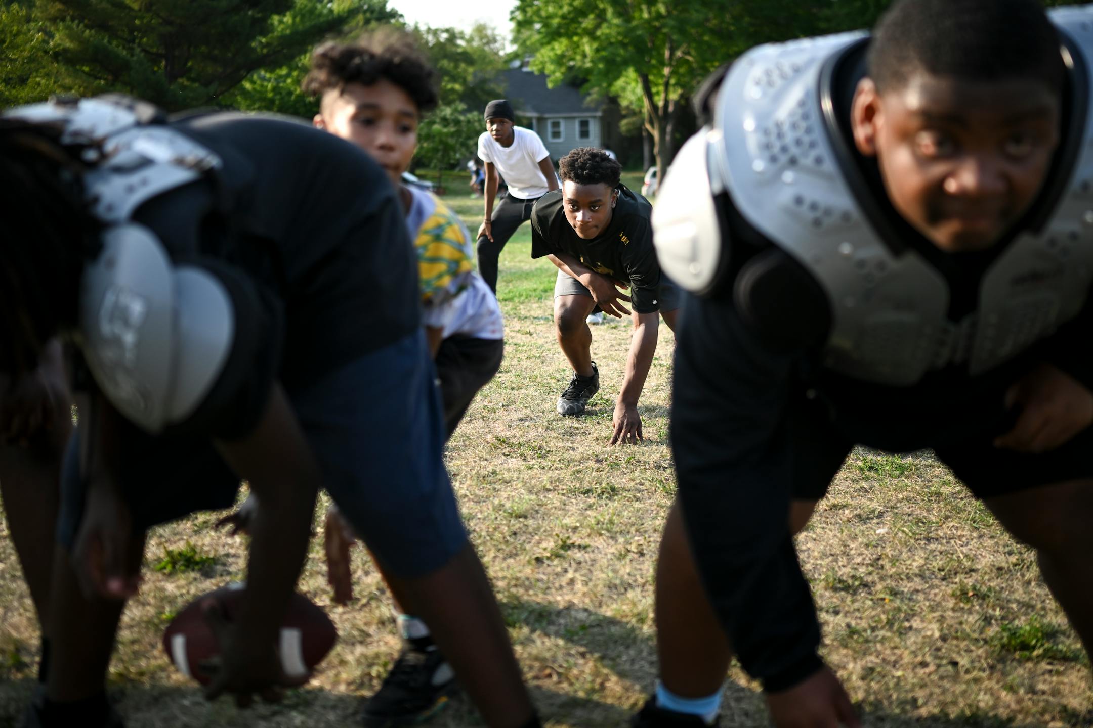 Marquel Mitchell, center, prepares to run the football during practice.