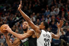Timberwolves center Rudy Gobert went to the basket against Brooklyn Nets center Nicolas Claxton in the second quarter Friday