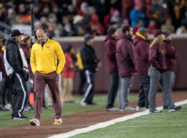 Minnesota coach P.J. Fleck walked down the sideline during the fourth quarter of a blowout loss to Wisconsin.