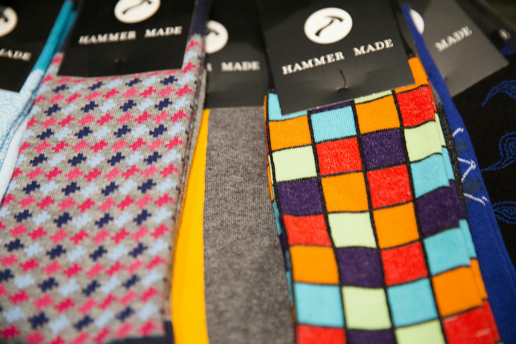 Colorful socks for sale at Hammer Made men’s store at Galleria Edina.