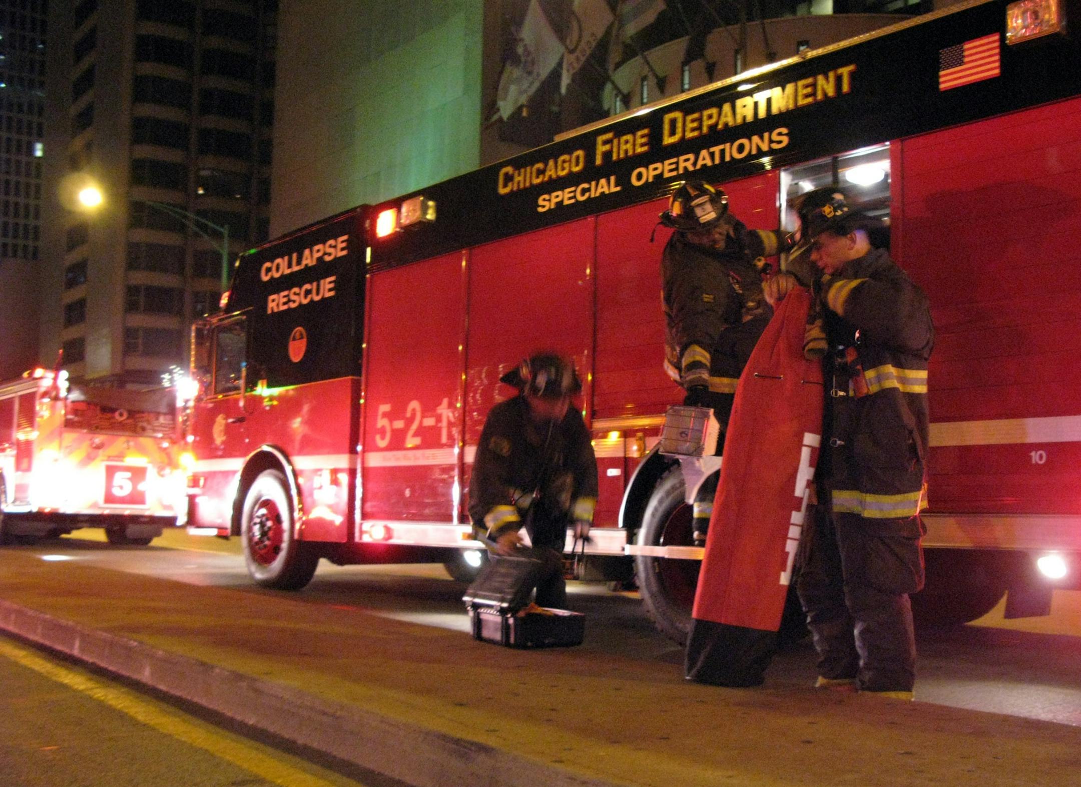 Chicago Fire Dept. responds to an incident early Thursday, Dec. 12, 2012, at the Intercontinel Hotel at 505 N. Michigan Ave., where a man trying to take a photo from the top of the hotel fell 22 feet down a smokestack, authorities said. The man was pronounced dead at Northwestern Memorial Hospital. It took rescue crews four hours to remove the 23-year-old man from Minnesota.