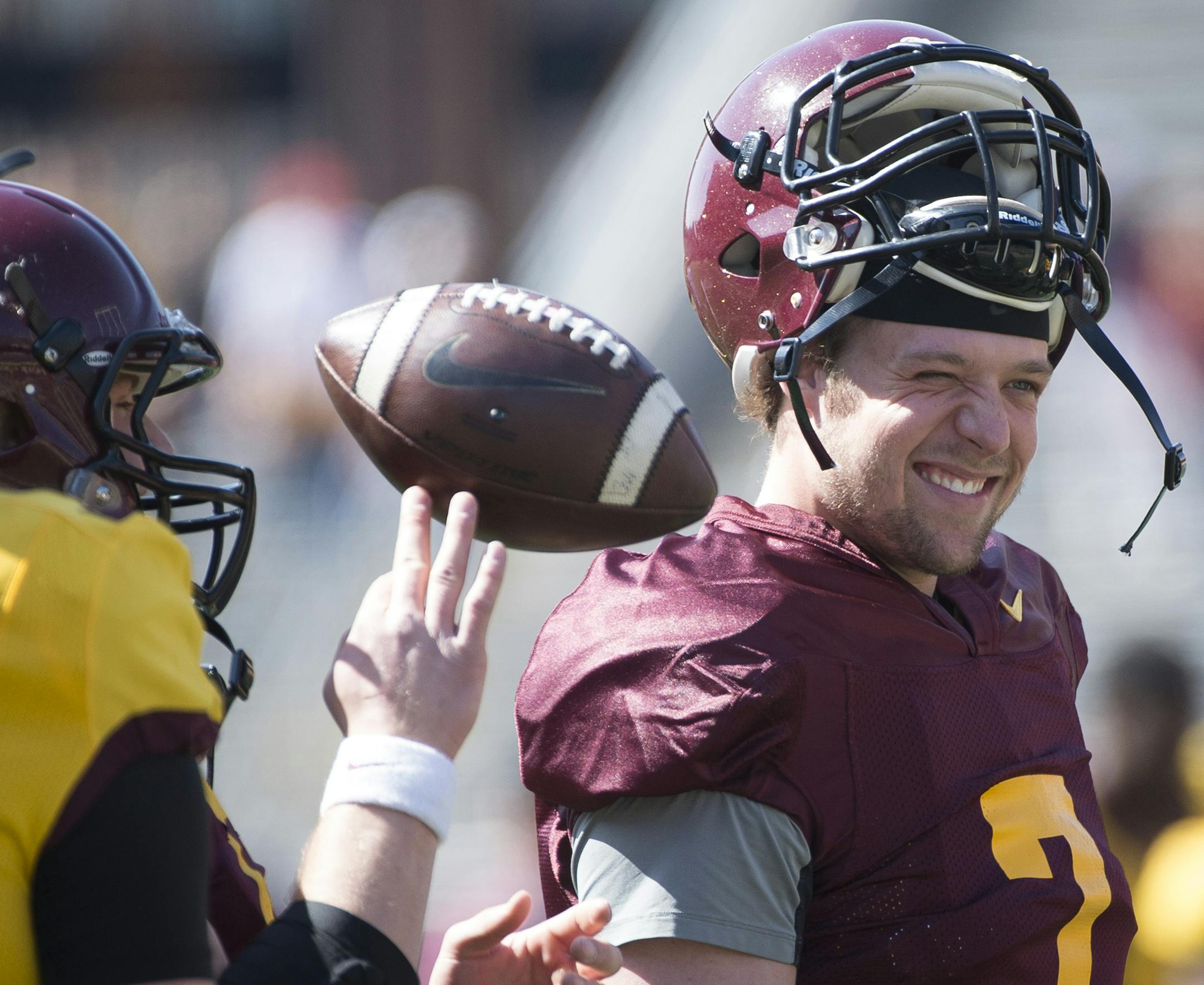 University of Minnesota quarterback Mitch Leidner (7) jokes with teammates before the start of Saturday's scrimmage. ] (Aaron Lavinsky | StarTribune) aaron.lavinsky@startribune.com The University of Minnesota football team participates in its annual spring game on Saturday, April 11, 2015 at TCF Bank Stadium in Minneapolis.
