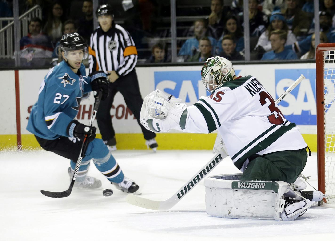 Wild goalie Darcy Kuemper, right, blocked a shot near San Jose's Joonas Donskoi during the first period Saturday in San Jose, Calif.