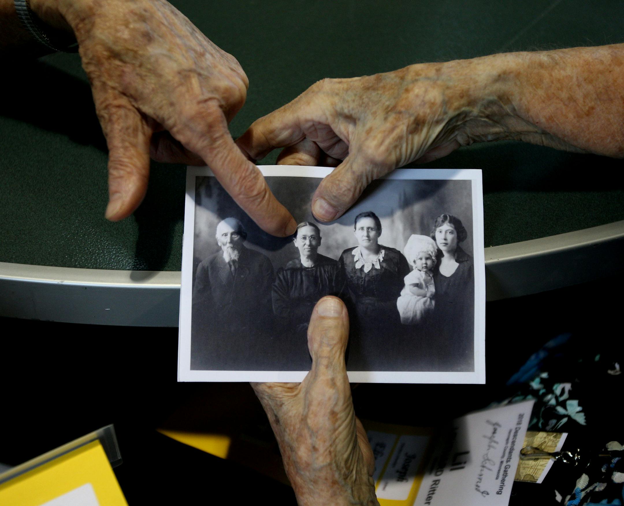 Lil Leuthard Ritter and Sister Agatha Grossman look at an old photo of Joseph Schmid and his immediate family. ] ALEX KORMANN &#x2022; alex.kormann@startribune.com Nearly 400 people from across the U.S. gathered at Gale Woods Farm in Minnetrista, MN for a reunion of the Schmid family on Saturday June 16, 2018. The even was organized by Toni Schimd Stevenson, the great-great-granddaughter of Joseph Schmid, one of the shared ancestors of everyone in attendance. Joesph and Benedikt moved from Germa