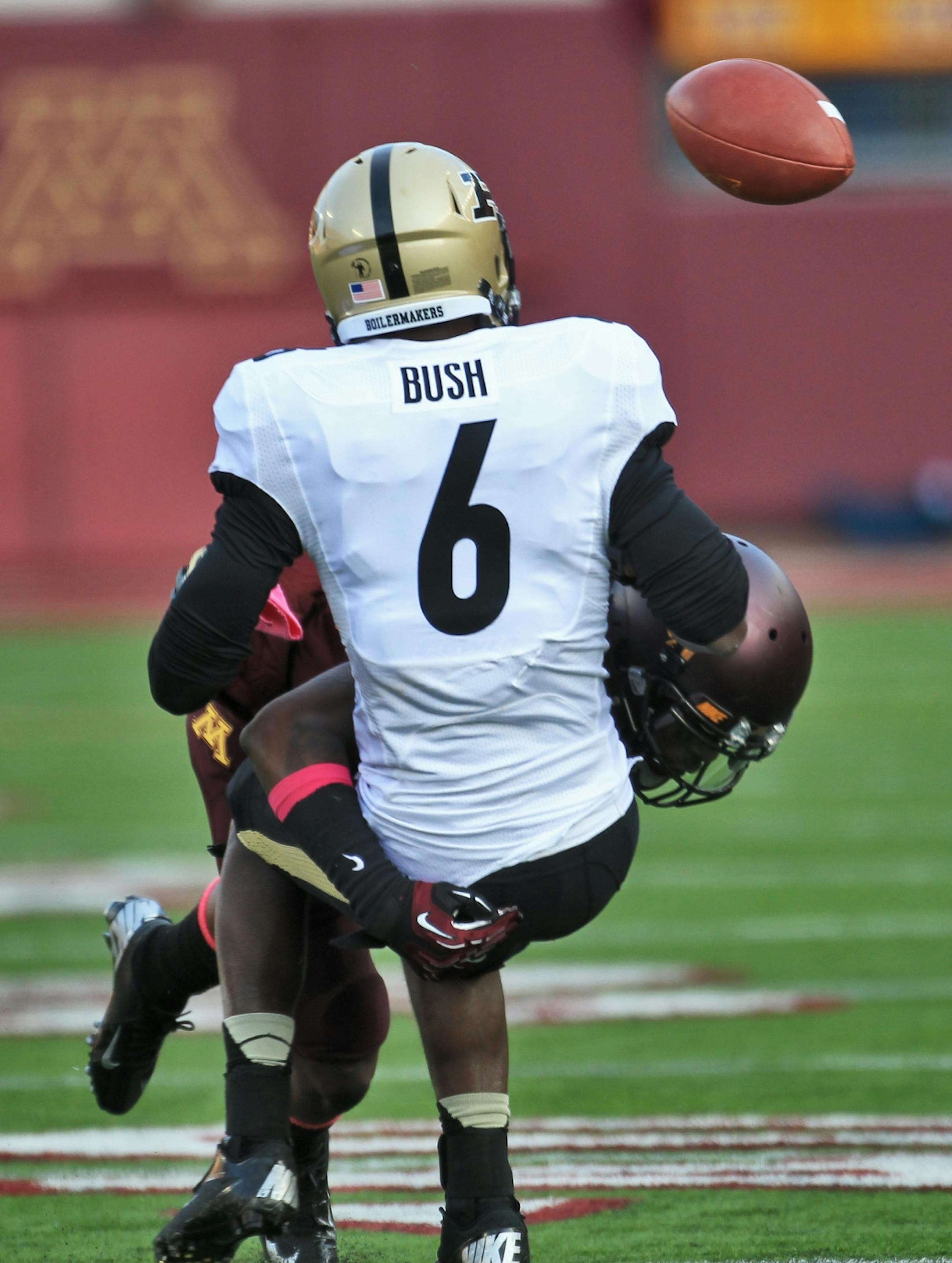 Gophers cornerback Michael Carter knocked the ball loose from Purdue intended receiver Gary Bush