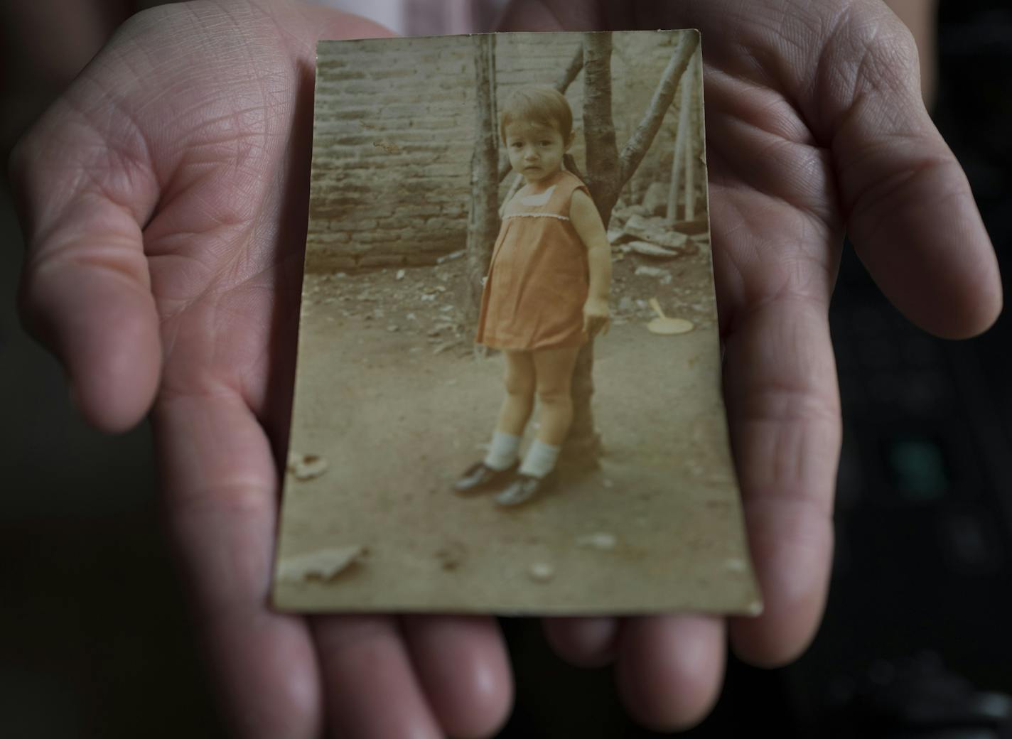 Gloria Velazquez was able to the stay in the United States legally after she received a U visa, for victims of serious crimes who cooperate with police. She is a live-in housekeeper for a family in St. Paul . In this photo she held a portrait of herself when she was a child in Mexico Thursday April 20, 2017 in St. Paul,MN.] JERRY HOLT &#xef; jerry.holt@startribune.com