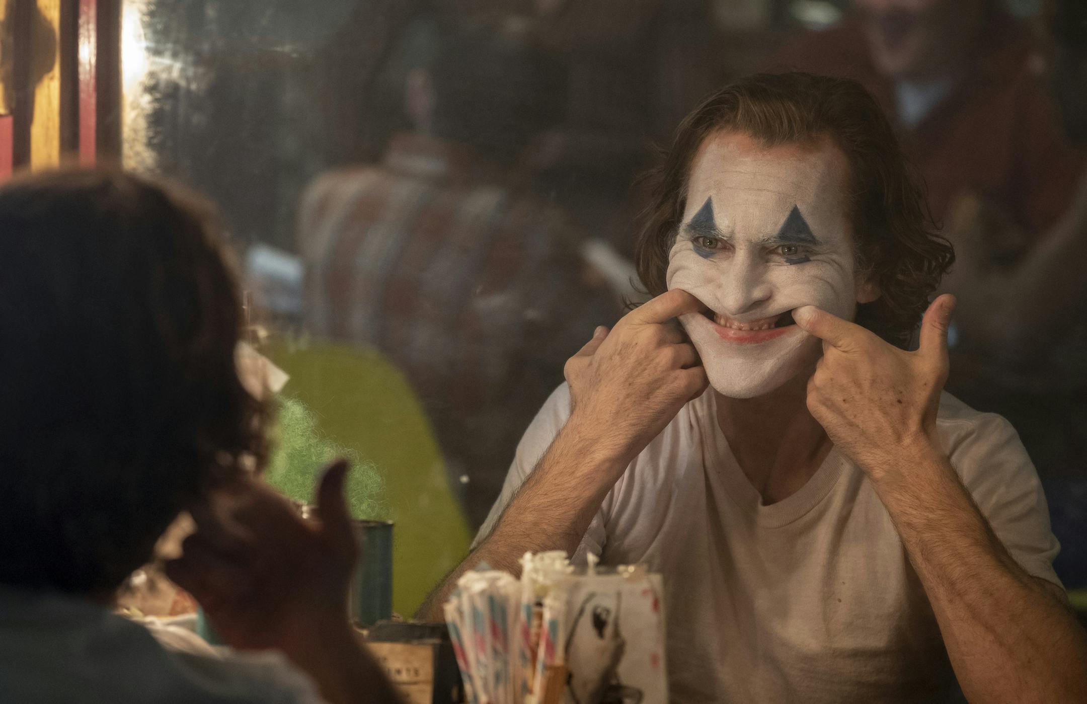 This image released by Warner Bros. Pictures shows Joaquin Phoenix in a scene from "Joker," in theaters on Oct. 4. (Niko Tavernise/Warner Bros. Pictures via AP)