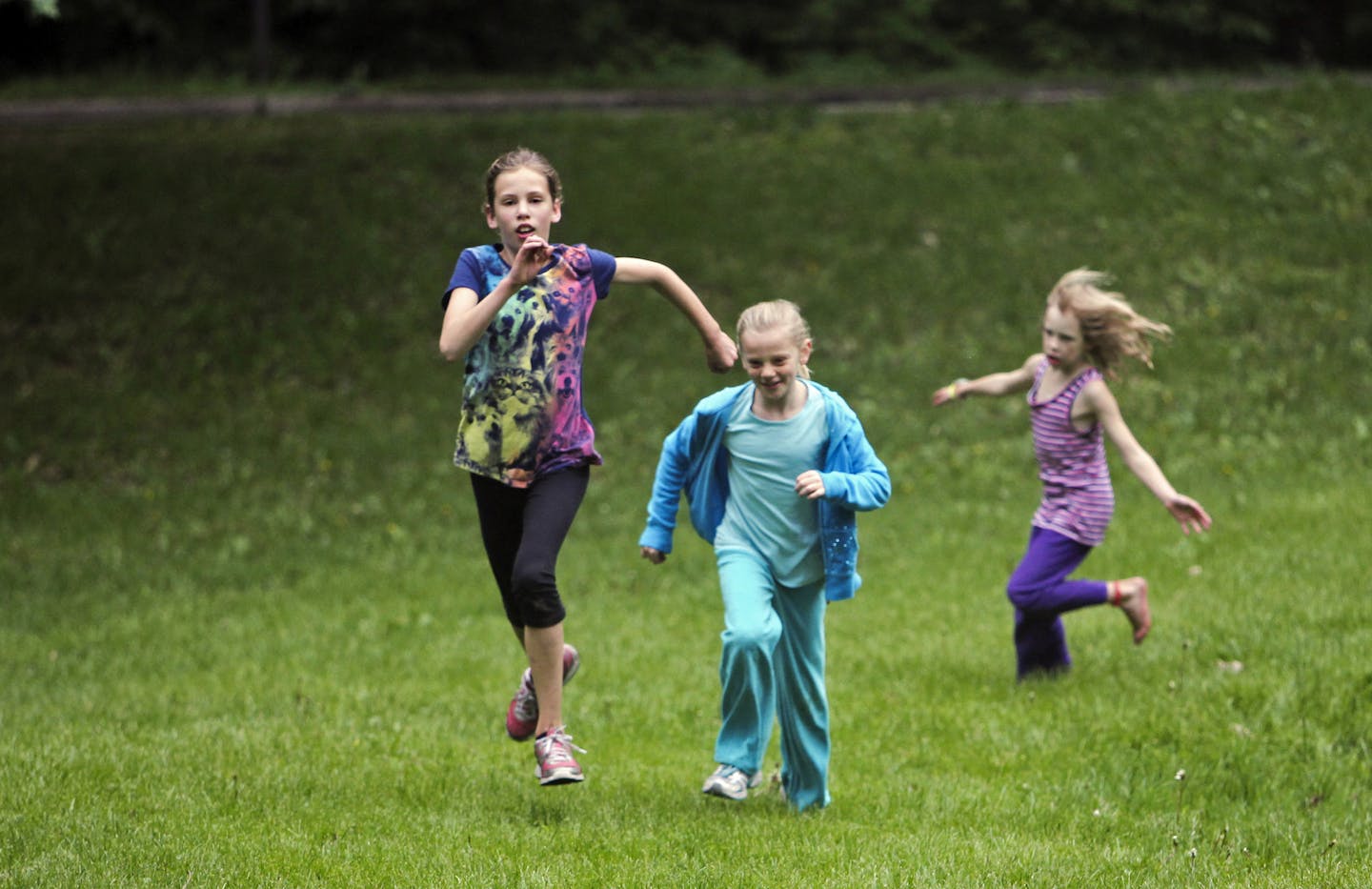 Friends Sonja Minge, 9, left to right, Esme Fisher, 10, and Sonja's sister Joy, 7, and Elsa Fisher, not pictured, race in green space in Lake Harriet Park Wednesday, June 5, 2013, in Minneapolis, MN. The girls were spending time playing in the park as their moms, Tazia Brunetti and Laura Stegenga, sat nearby and watched.](DAVID JOLES/STARTRIBUNE) djoles@startribune.com A national park-preservations nonprofit rated Minneapolis parks No. 1 in the country among the 50 largest cities.**Sonja Minge,