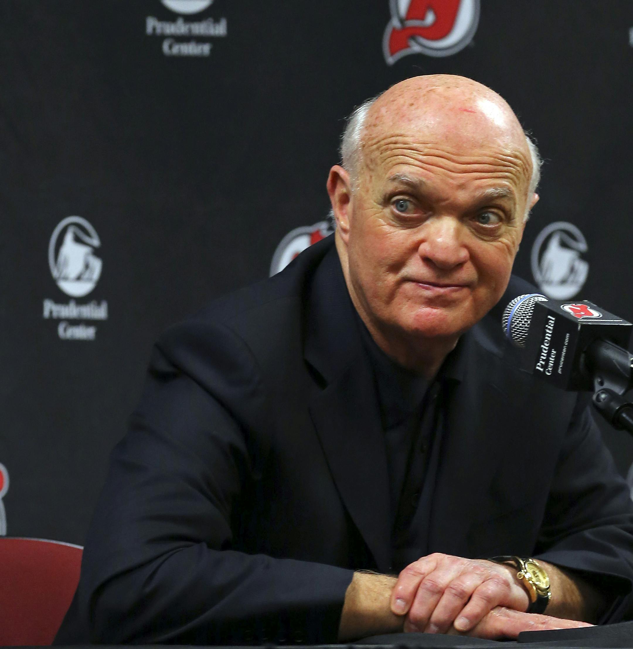 New Jersey Devils president and general manager Lou Lamoriello makes an announcement regarding the teams head coach during an NHL hockey news conference on Saturday, Dec. 27, 2014, in Newark, N.J. Devils are replacing the fired Pete DeBoer with a three-headed coaching staff. Former Washington Capitals coach Adam Oates, ex-Devils assistant and star defenseman Scott Stevens and Lamoriello will split duties on the bench. (AP Photo/Adam Hunger)