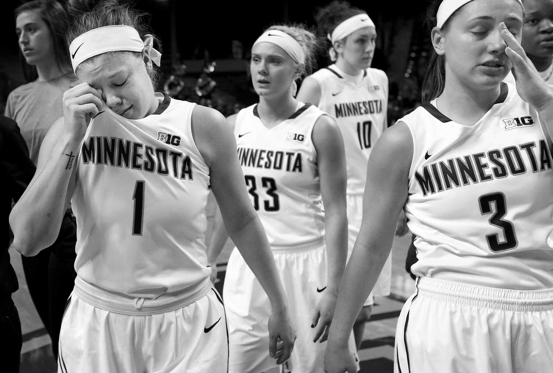 Rachel Banham (1) and teammates Carlie Wagner (33) and Shayne Mullaney (3) walked off the court at the end of the game. South Dakota beat Minnesota by a final score of 101-89 in the WNIT. Banham finished with 37-points. It was the final game Banham and Mullaney would play for the University of Minnesota.