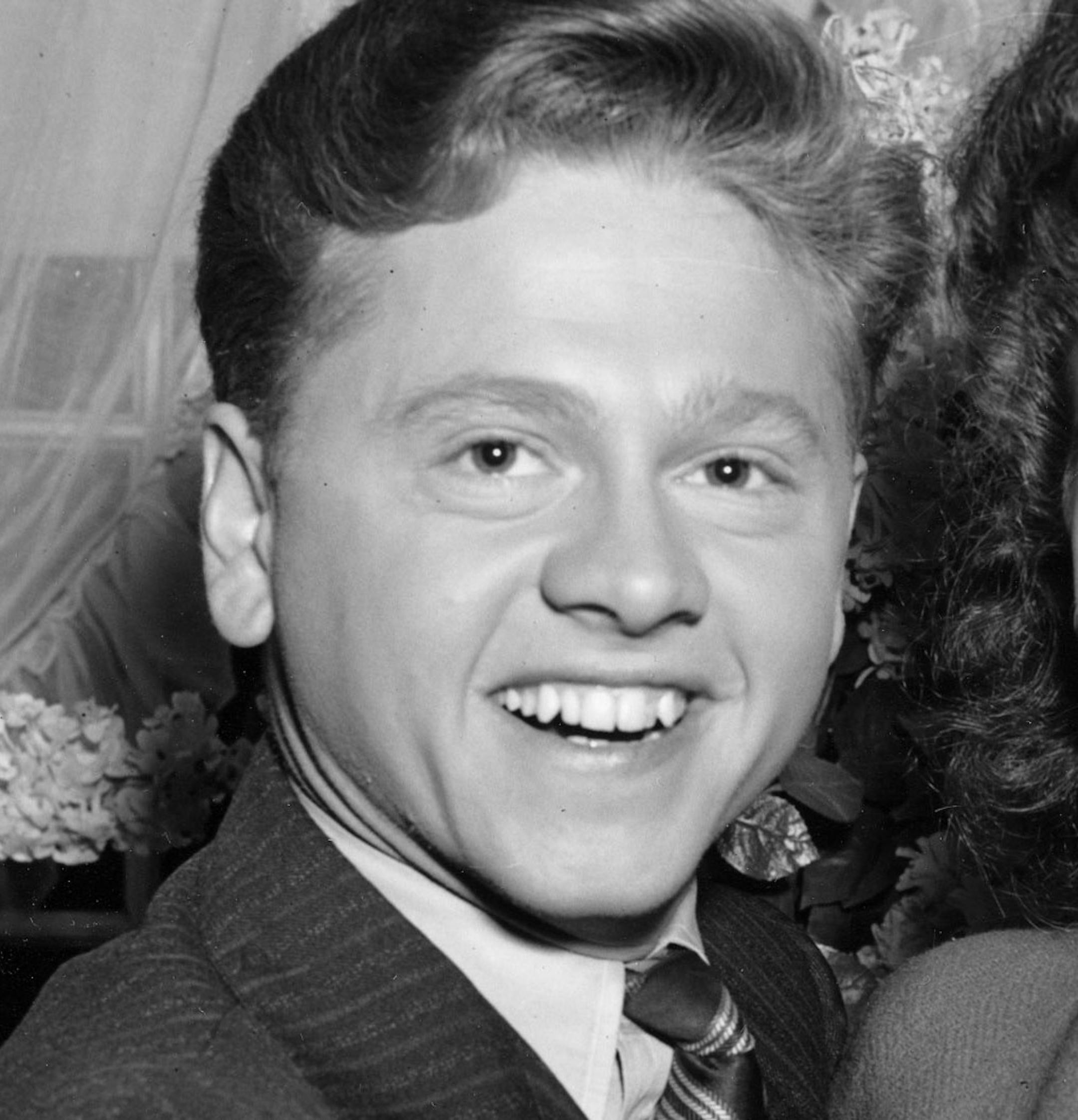 FILE - In this Jan. 5, 1942, file photo, Mickey Rooney, 21, Movieland's No. 1 box office star, and Ava Gardner, 19, of Wilson, N.C., pose together in Santa Barbara, Calif., shortly after the couple applied for a marriage license. Rooney, a Hollywood legend whose career spanned more than 80 years, has died. He was 93. Los Angeles Police Commander Andrew Smith said that Rooney was with his family when he died Sunday, April 6, 2014, at his North Hollywood home. (AP Photo/File)