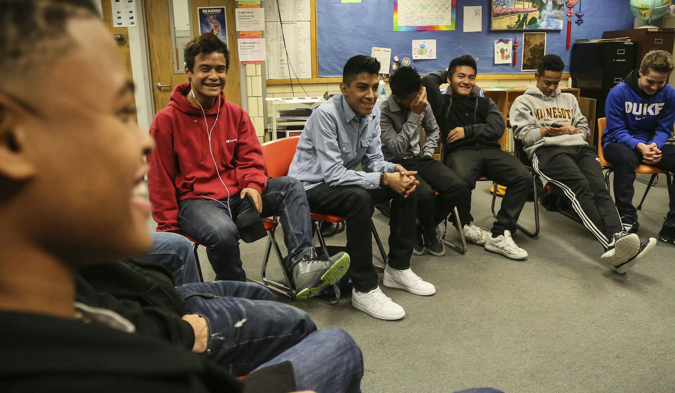 The Multiculural Leaders group, formerly the African American Karen Alliance, meets at Roseville High School three times a month and met Wednesday, Nov. 19, 2014, in Roseville, MN. Here, to a rapt group, Benjamin Carter Jr., left, talks about the petty things that used to cause fights between African-American and Karen students. ](DAVID JOLES/STARTRIBUNE)djoles@startribune The Multiculural Leaders group, formerly the African American Karen Alliance, meets at Roseville High School three times a m